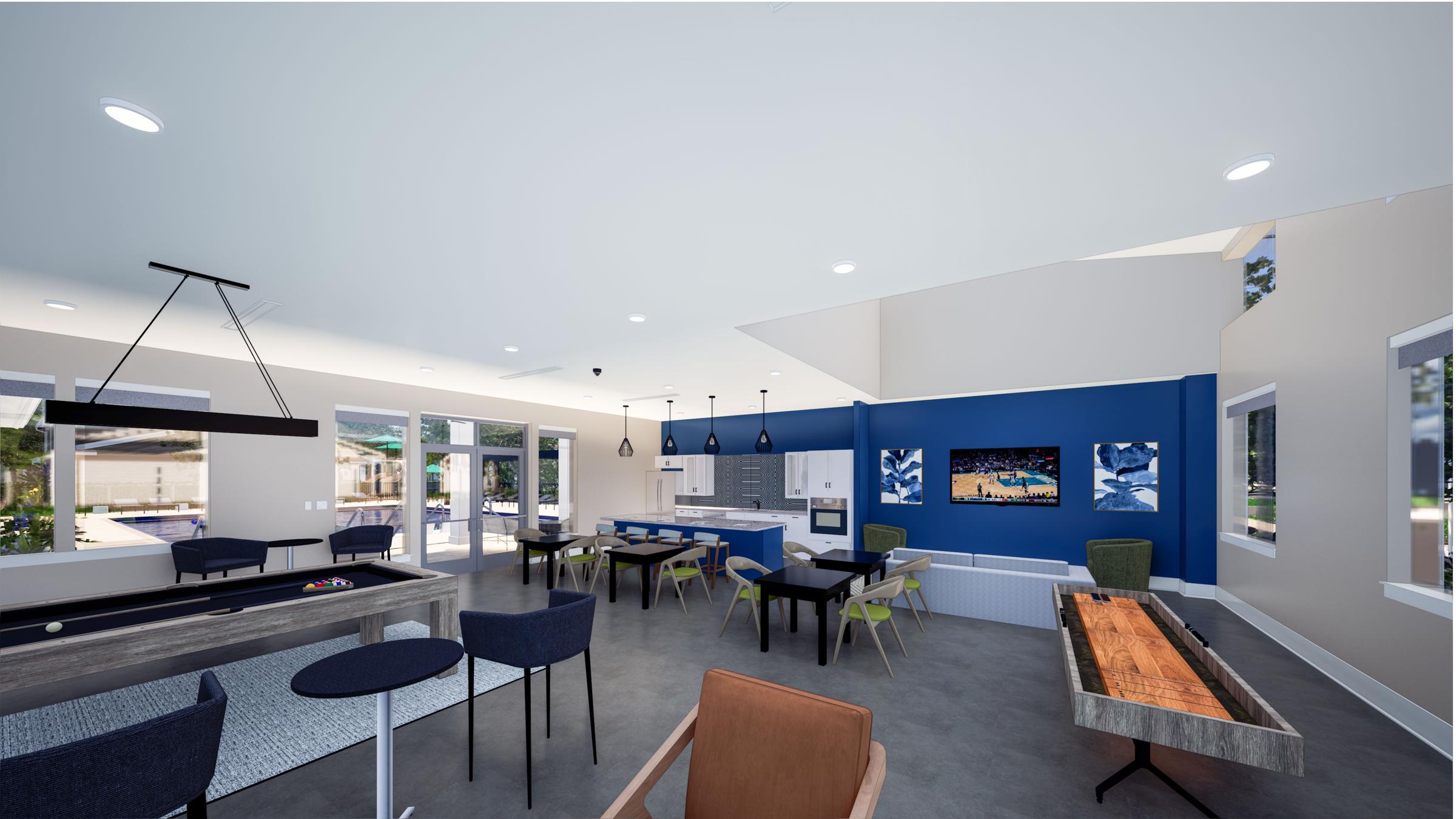 Interior view of a modern recreational lounge with a pool table, seating areas, and large windows. The walls are painted in light colors with a blue accent wall featuring artwork. There are screens displaying images and a view of an outdoor area showing a pool. The space is well-lit and inviting.