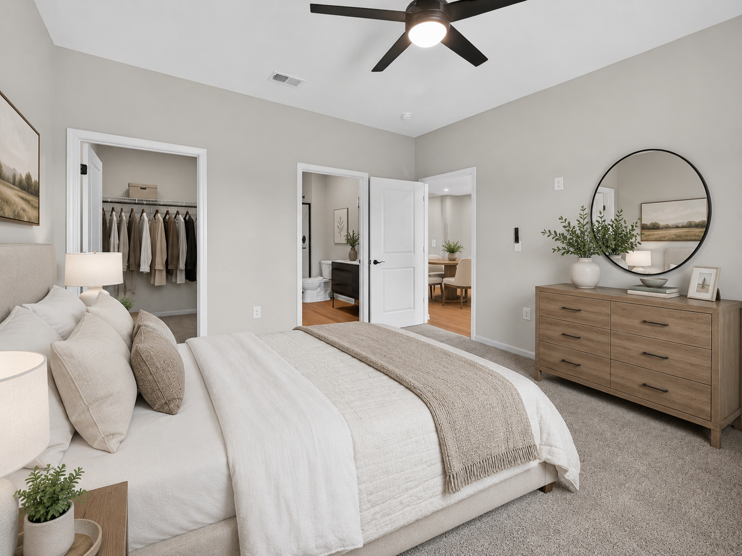 Step into comfort and style in this spacious bedroom, featuring modern touches and a serene atmosphere that makes it the perfect retreat after a long day.