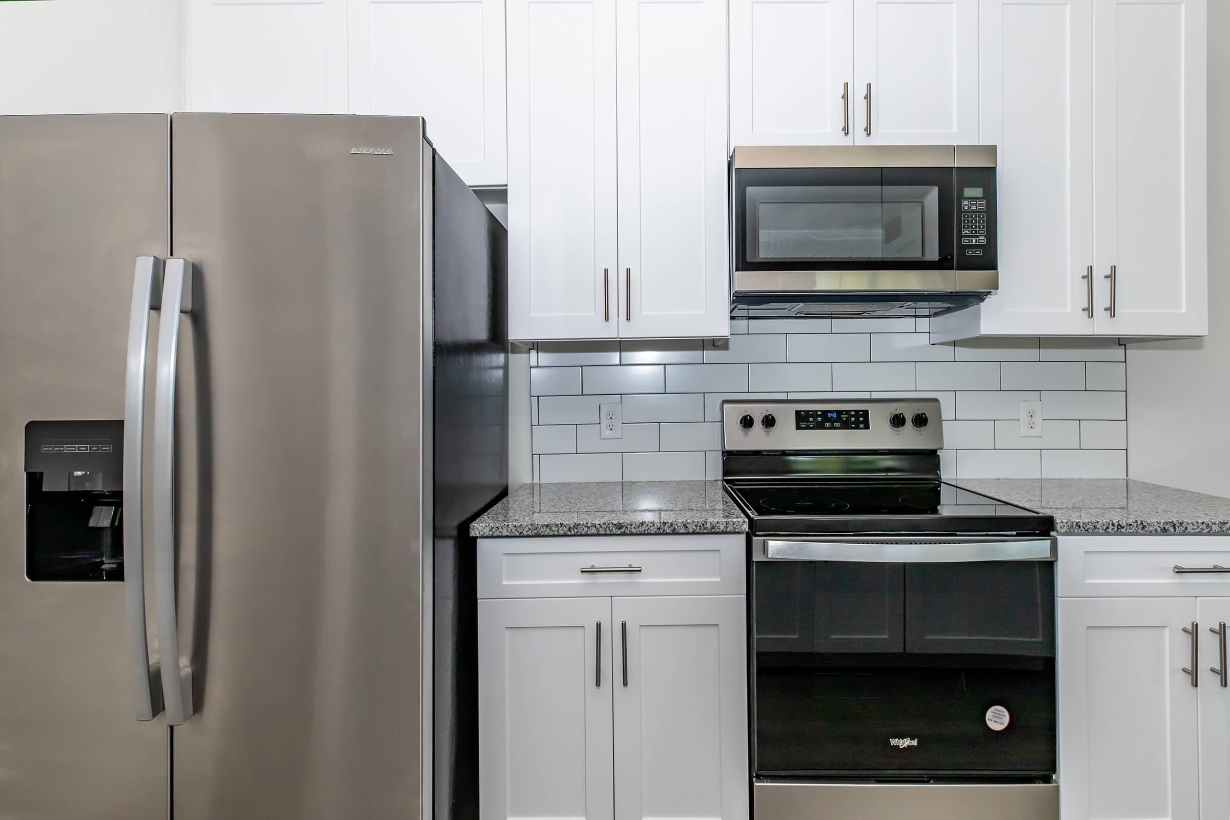 a stainless steel refrigerator in a kitchen