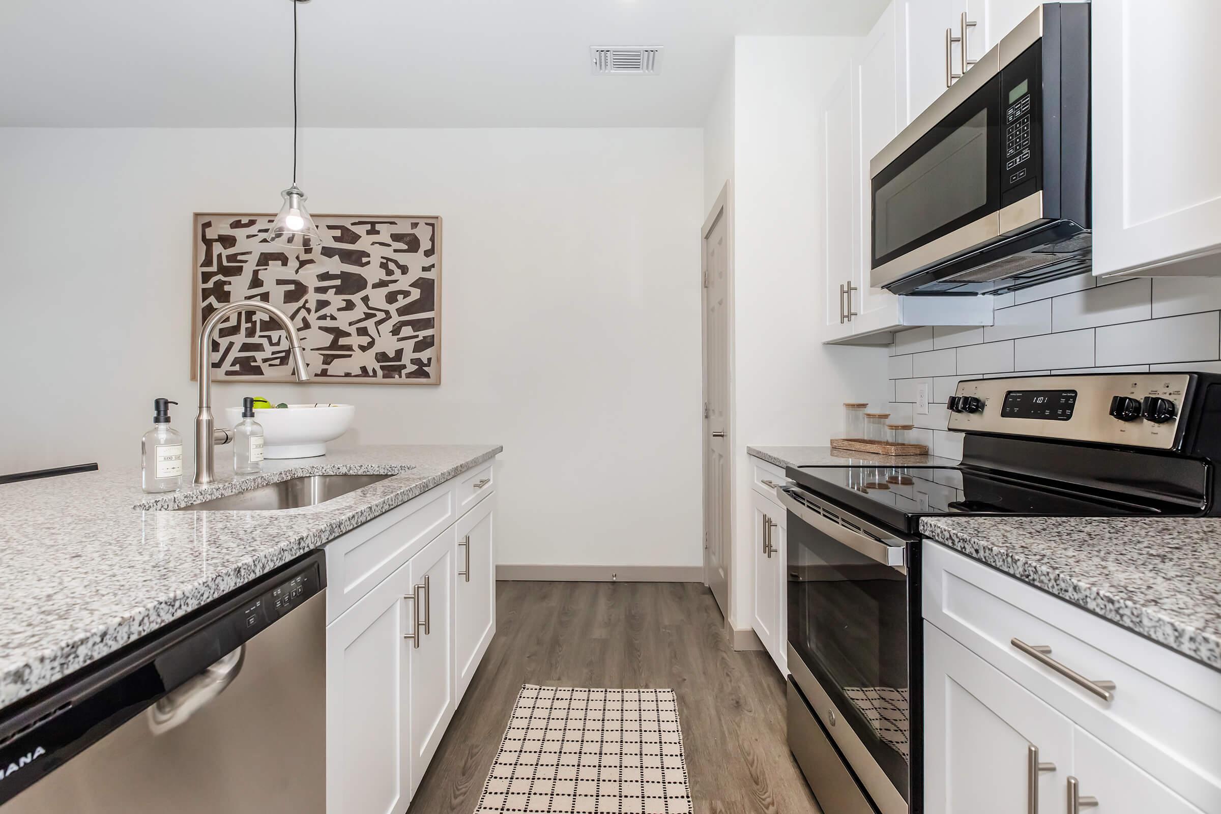 a kitchen with a stove top oven