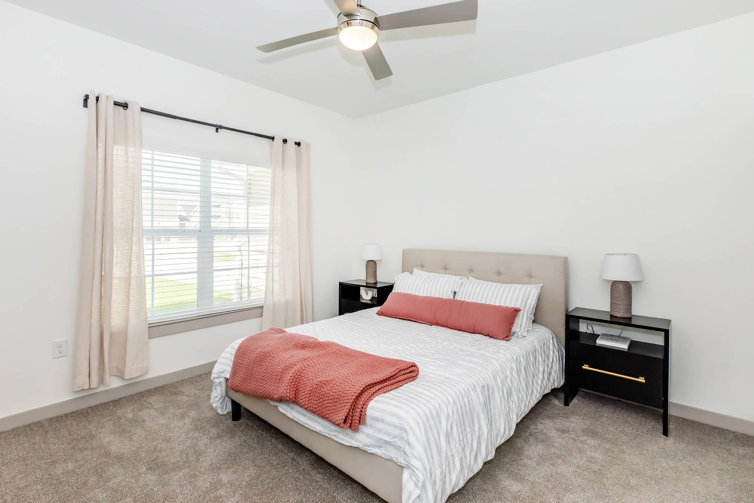 a bedroom with a large bed in a room