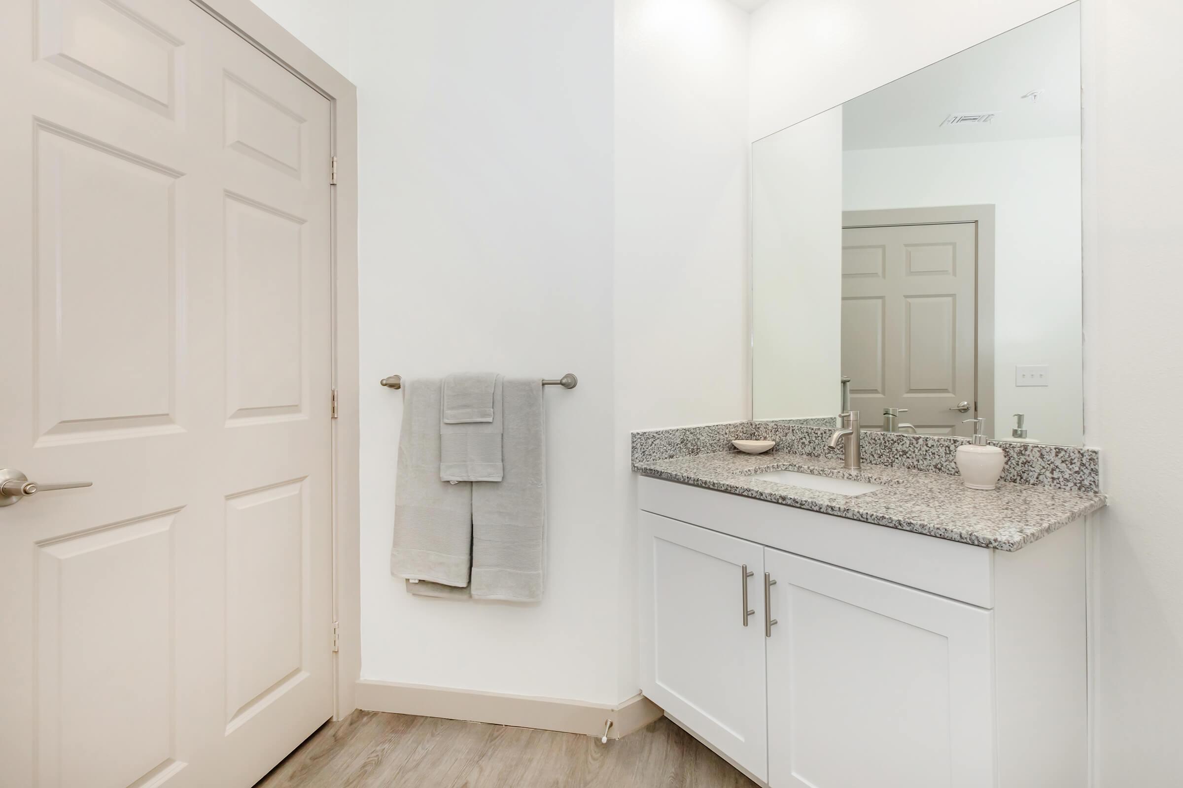 a kitchen with a sink and a refrigerator