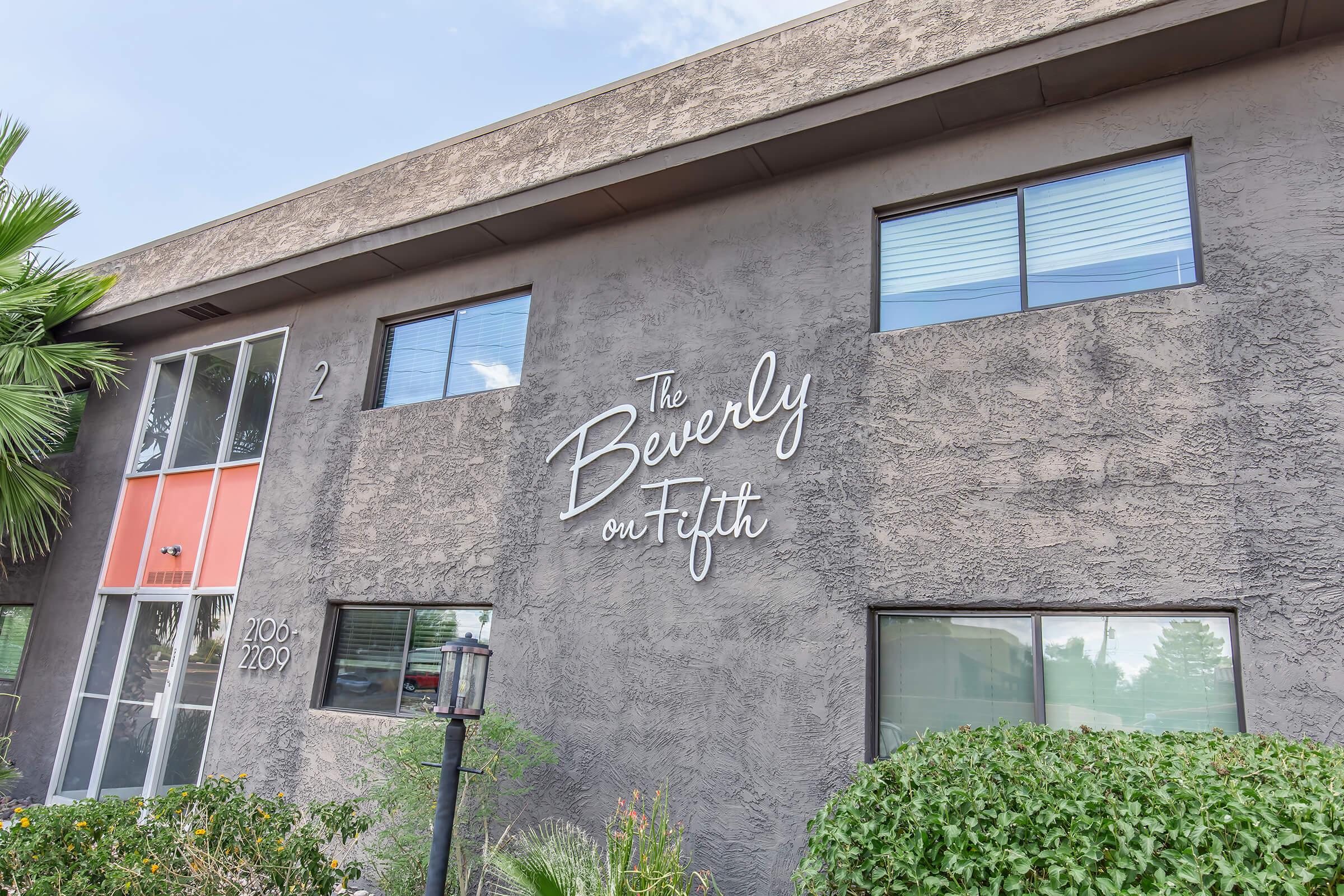 a sign in front of a brick building