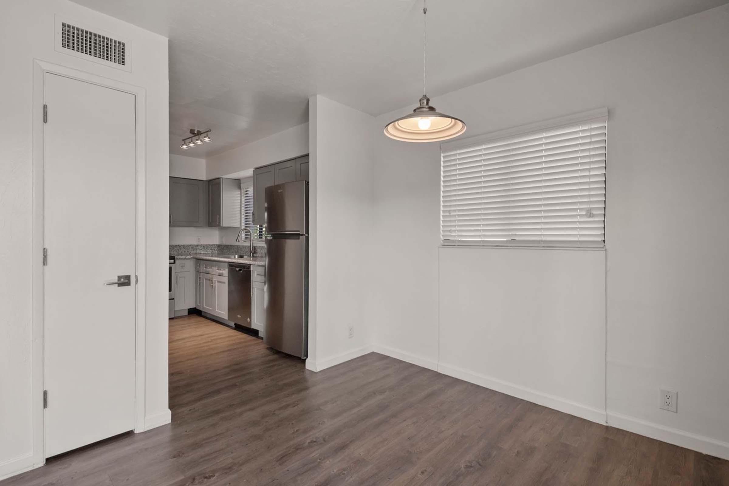 a kitchen with a wood floor