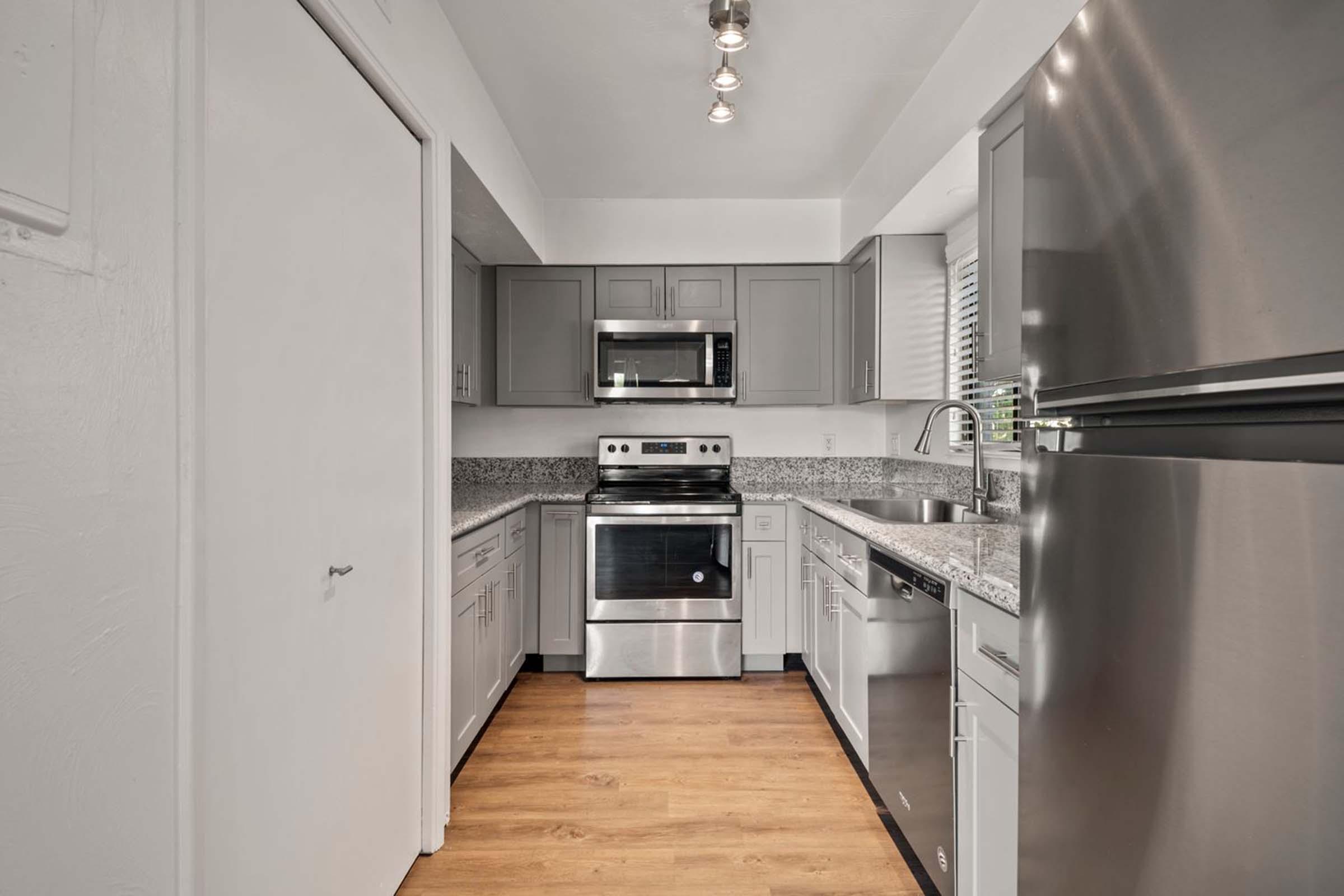 a large kitchen with stainless steel appliances