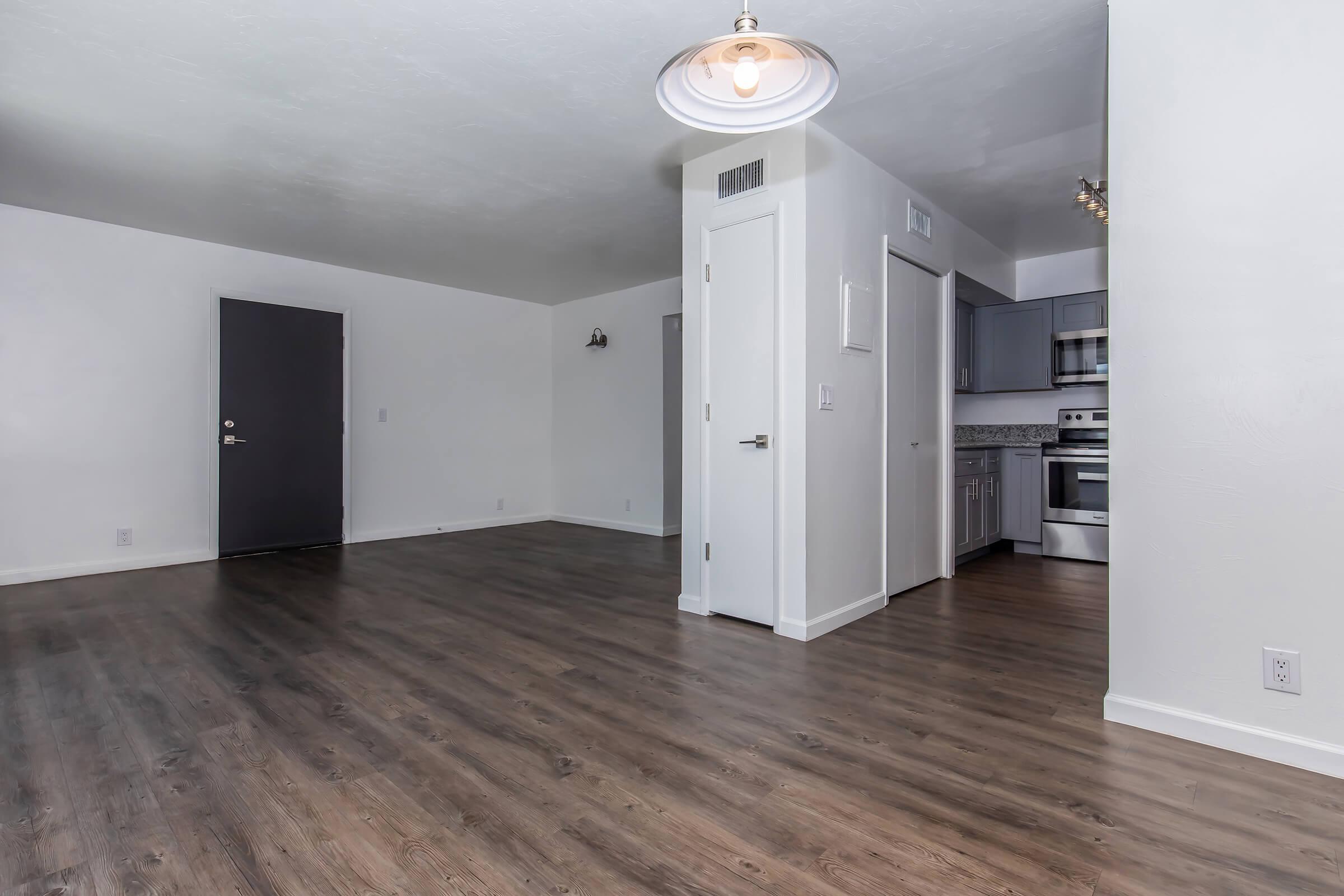 a kitchen with a wood floor