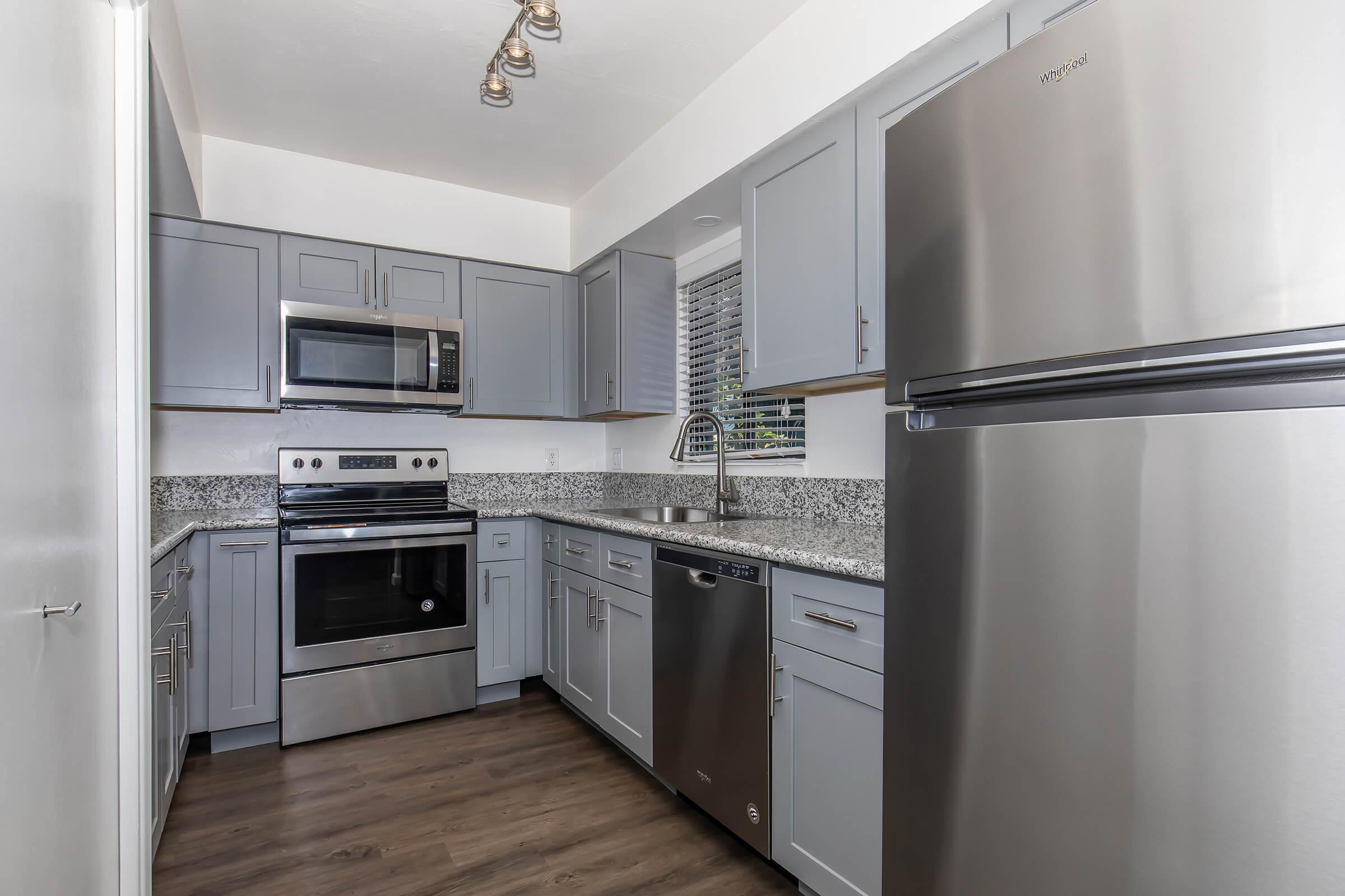 a kitchen with a stove and a refrigerator