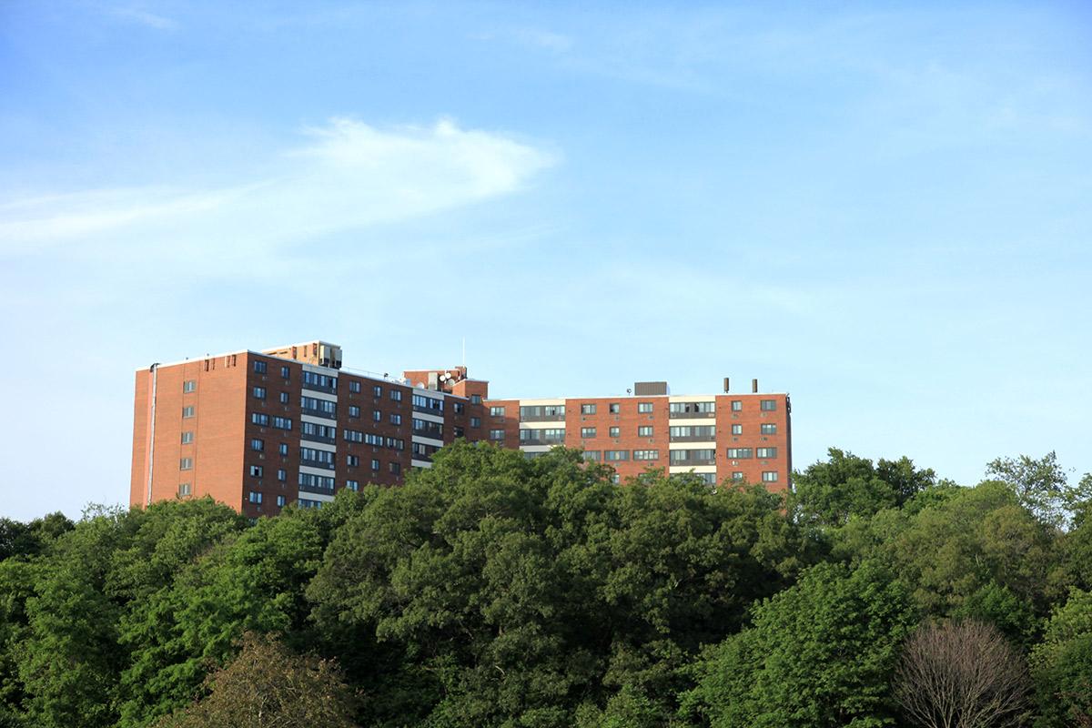 Loring Towers community building with green trees