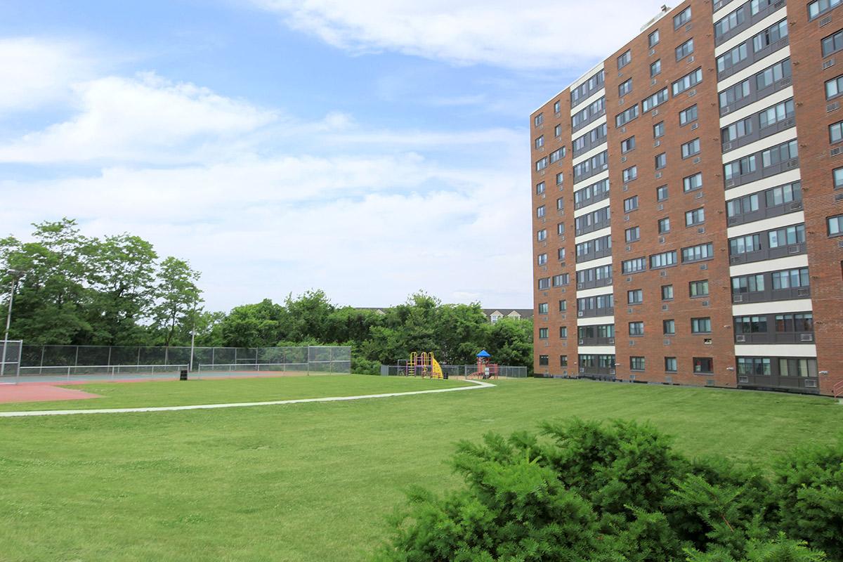 Loring Towers community building with green grass