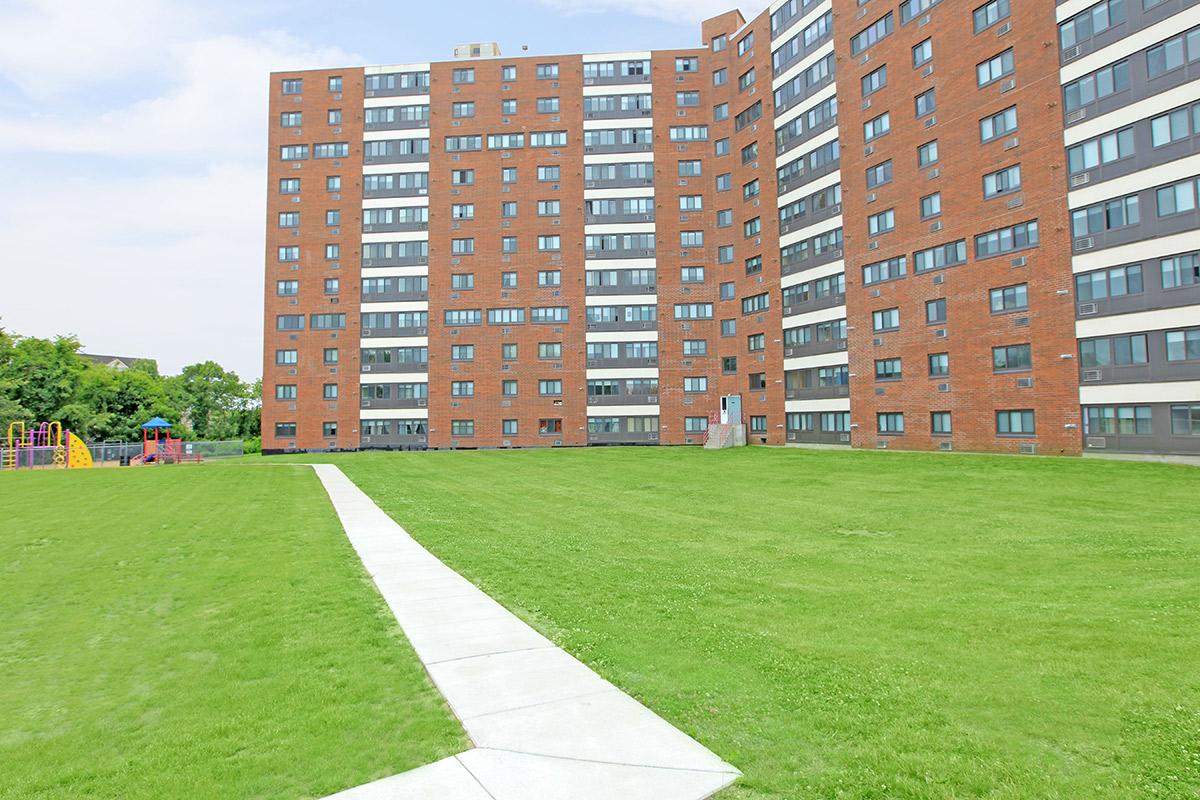 Community building with green grass