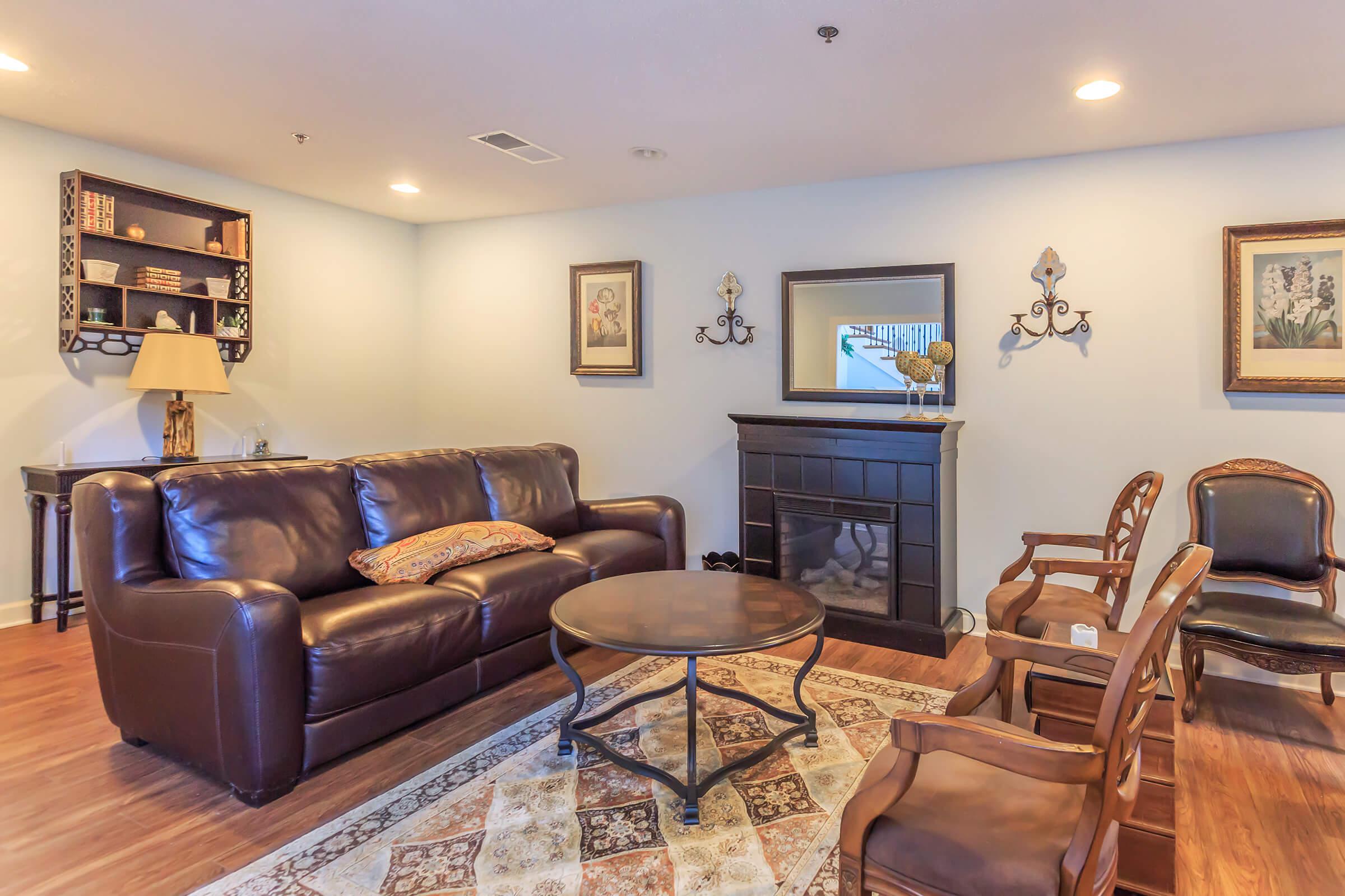 a living room filled with furniture and a fireplace