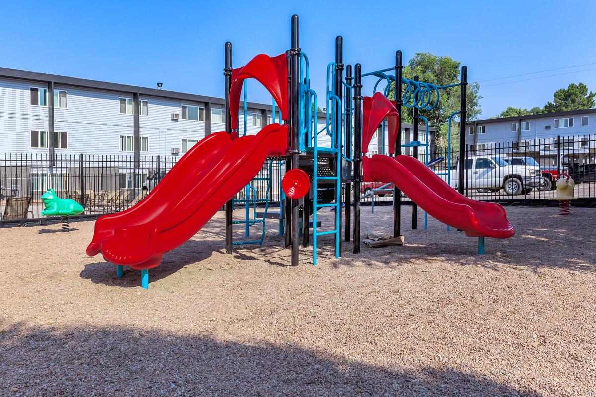 a group of lawn chairs sitting on top of a playground