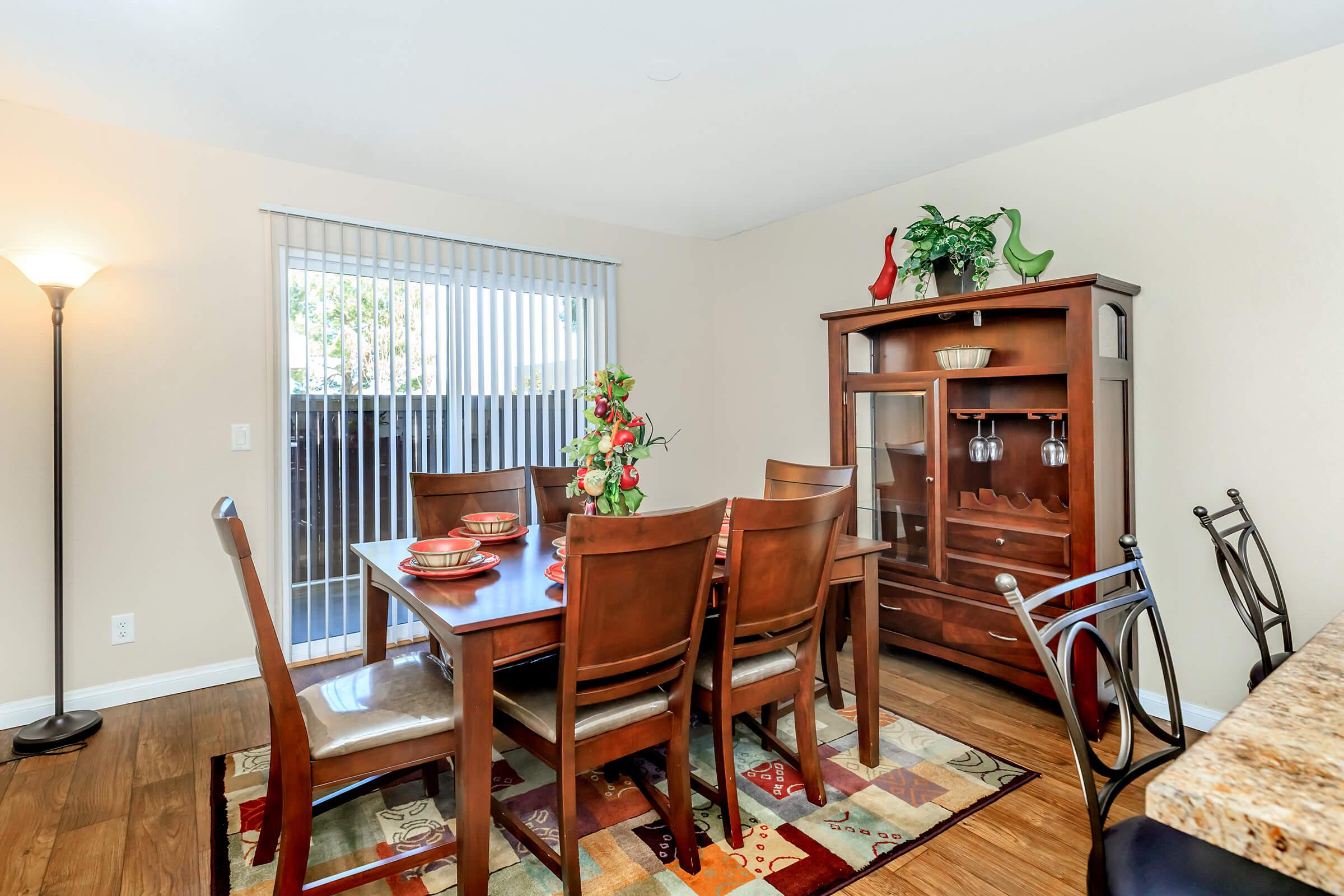 a living room filled with furniture and a window