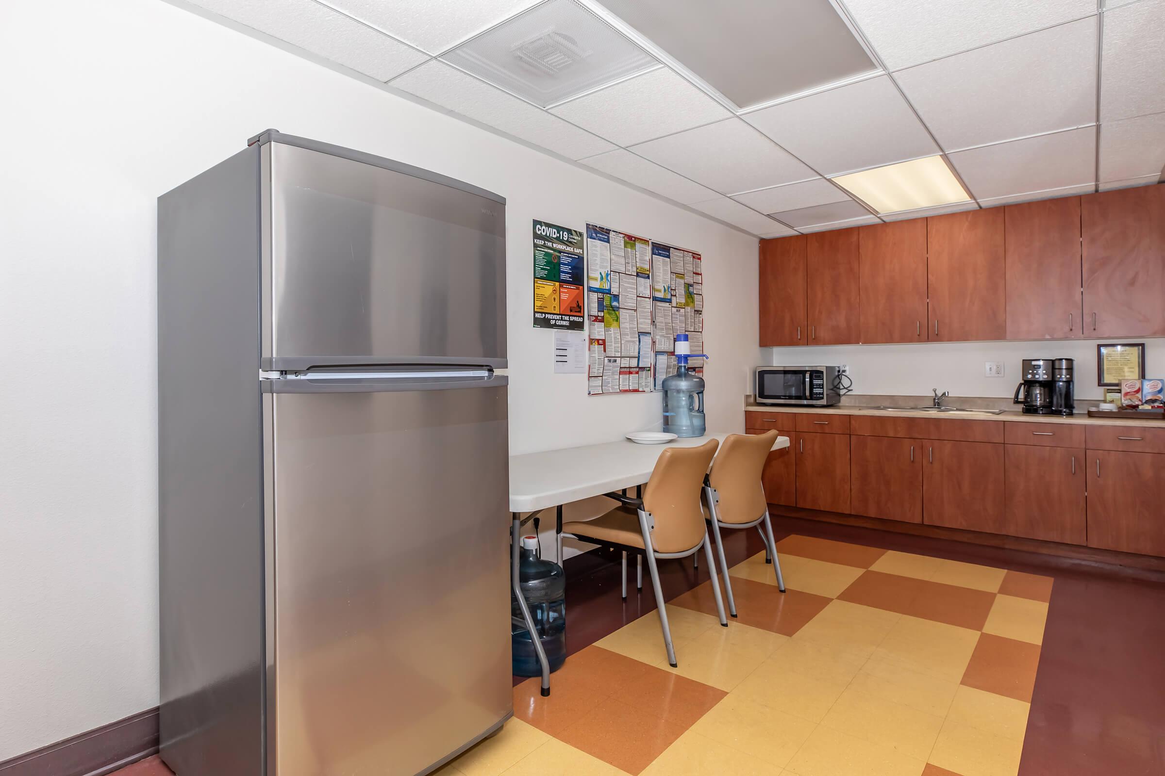 a stainless steel refrigerator in a kitchen