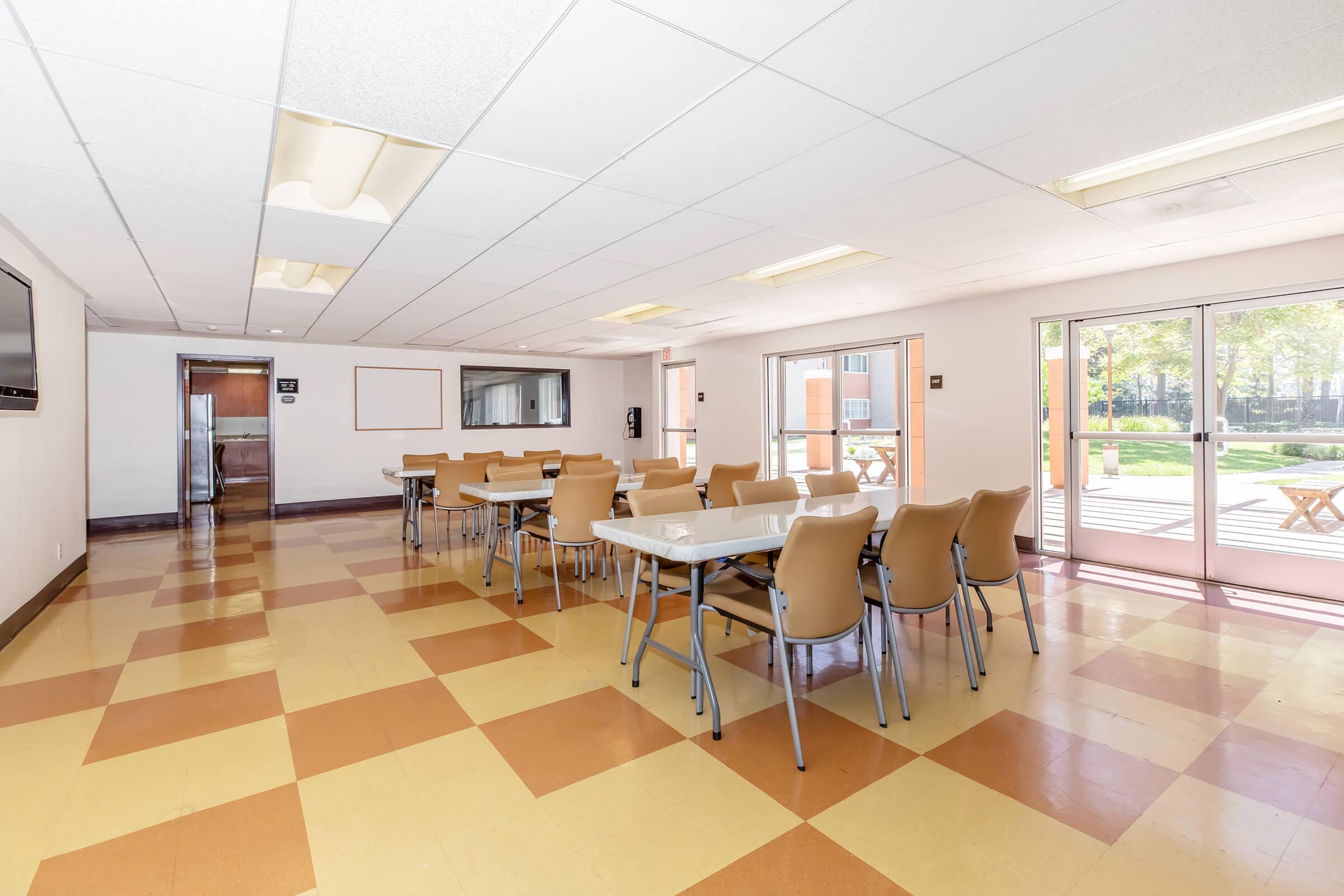 a dining room table in front of a tiled floor