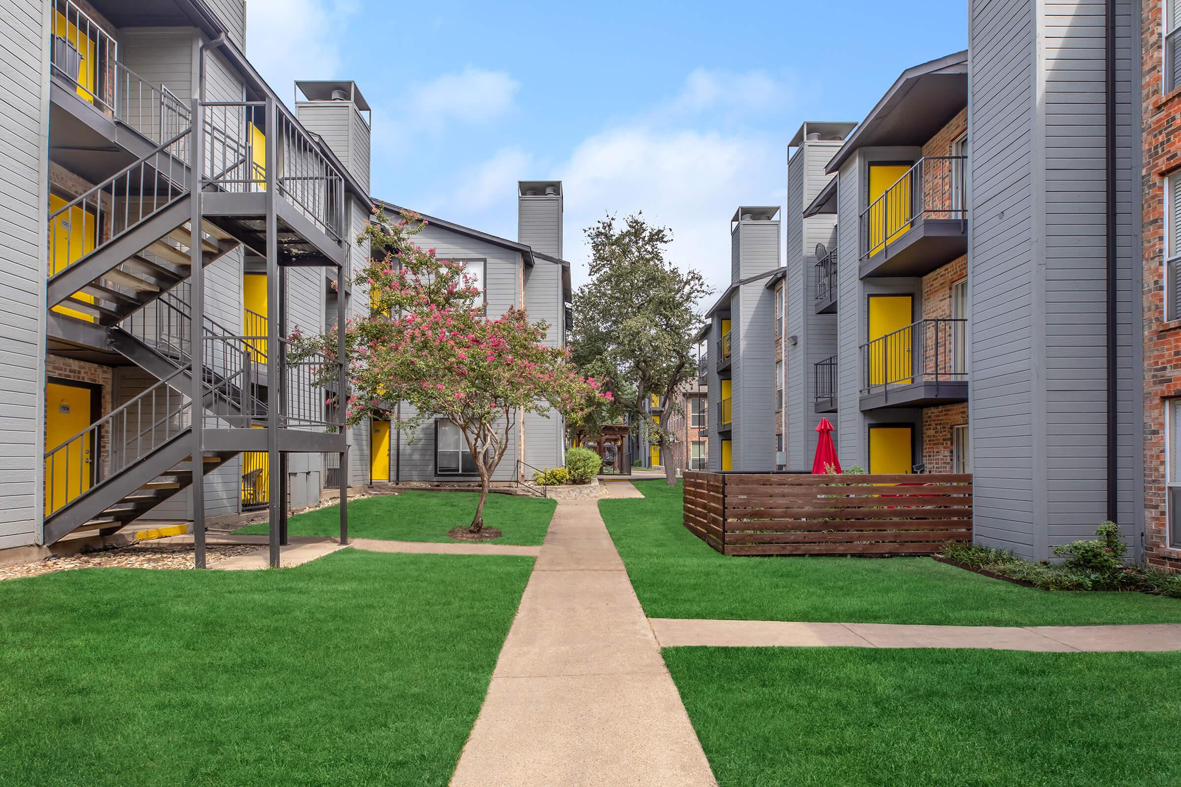 a large lawn in front of a building