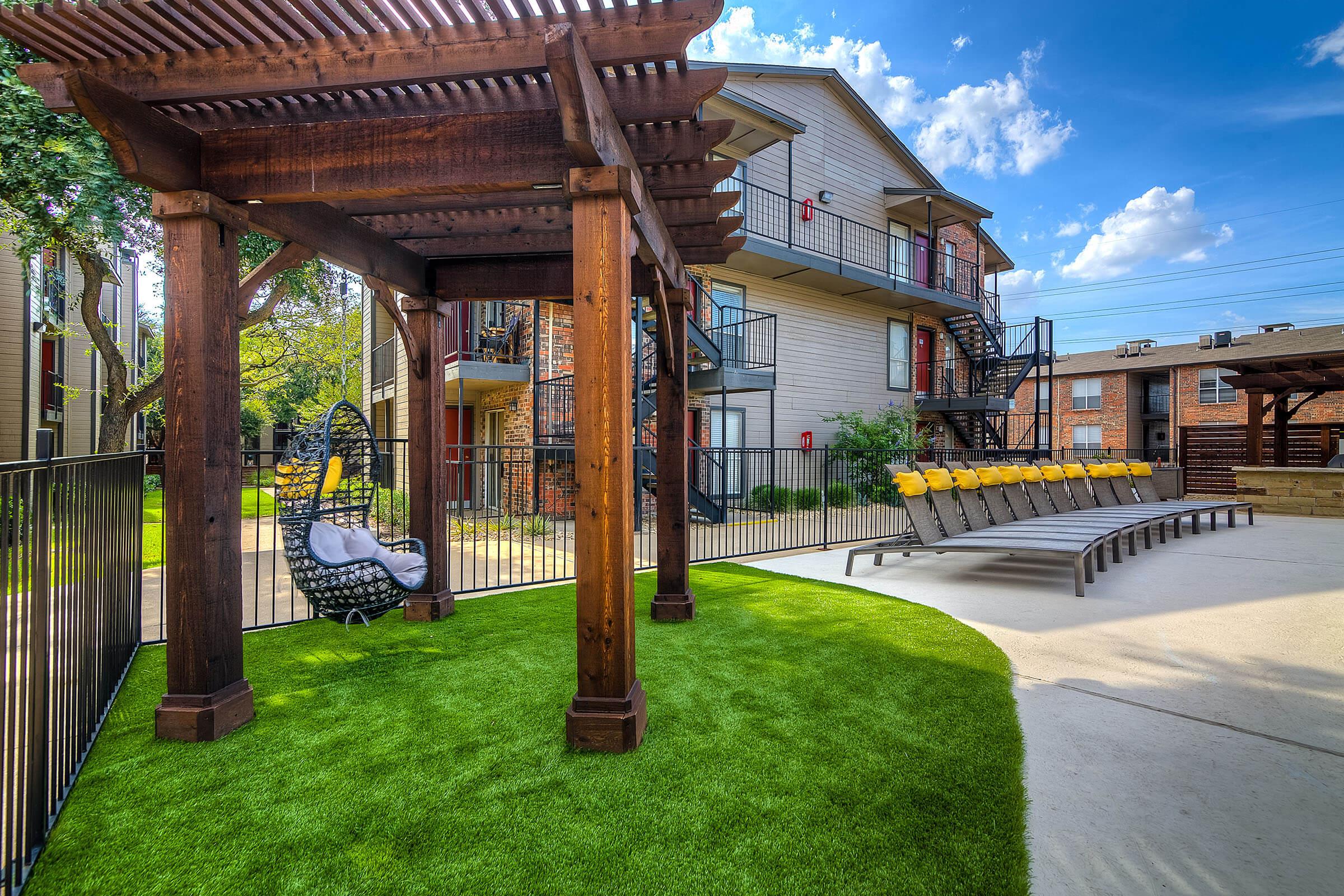 swinging chairs under pergolas