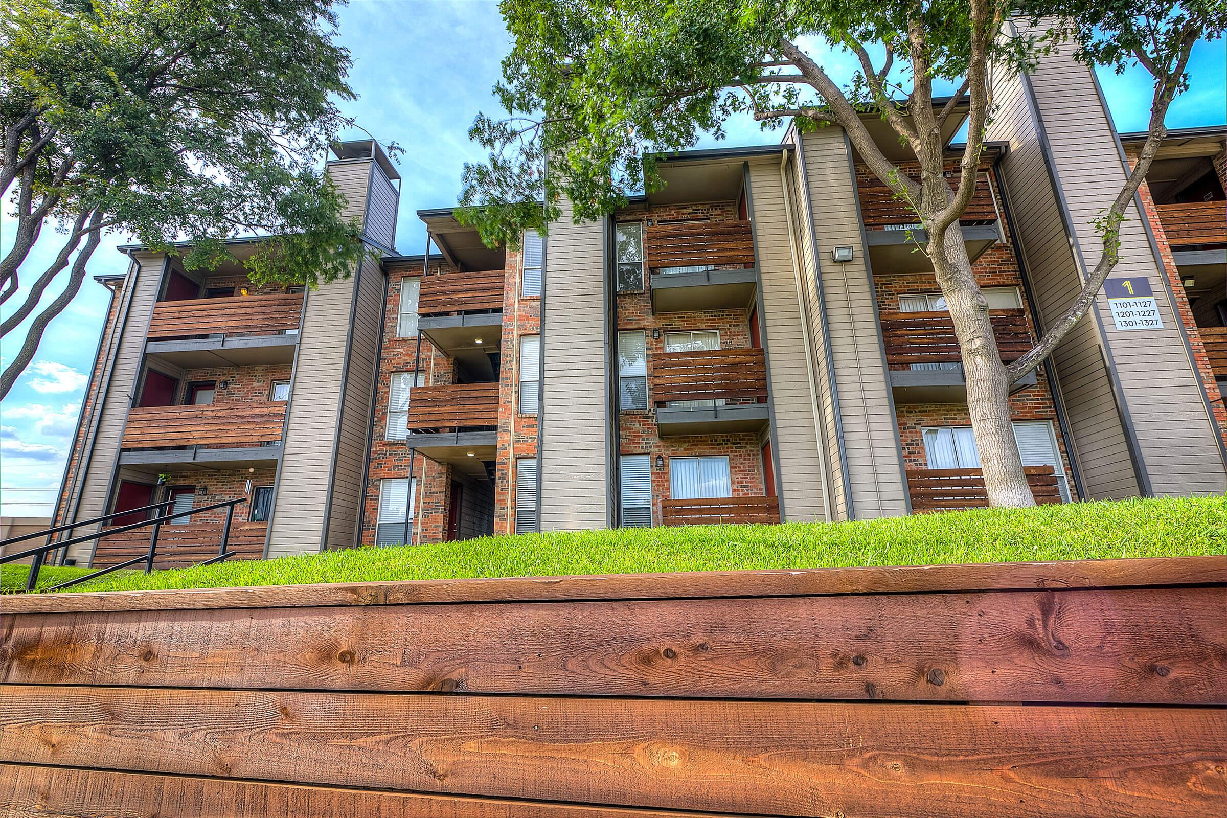 The Edge community building with green grass