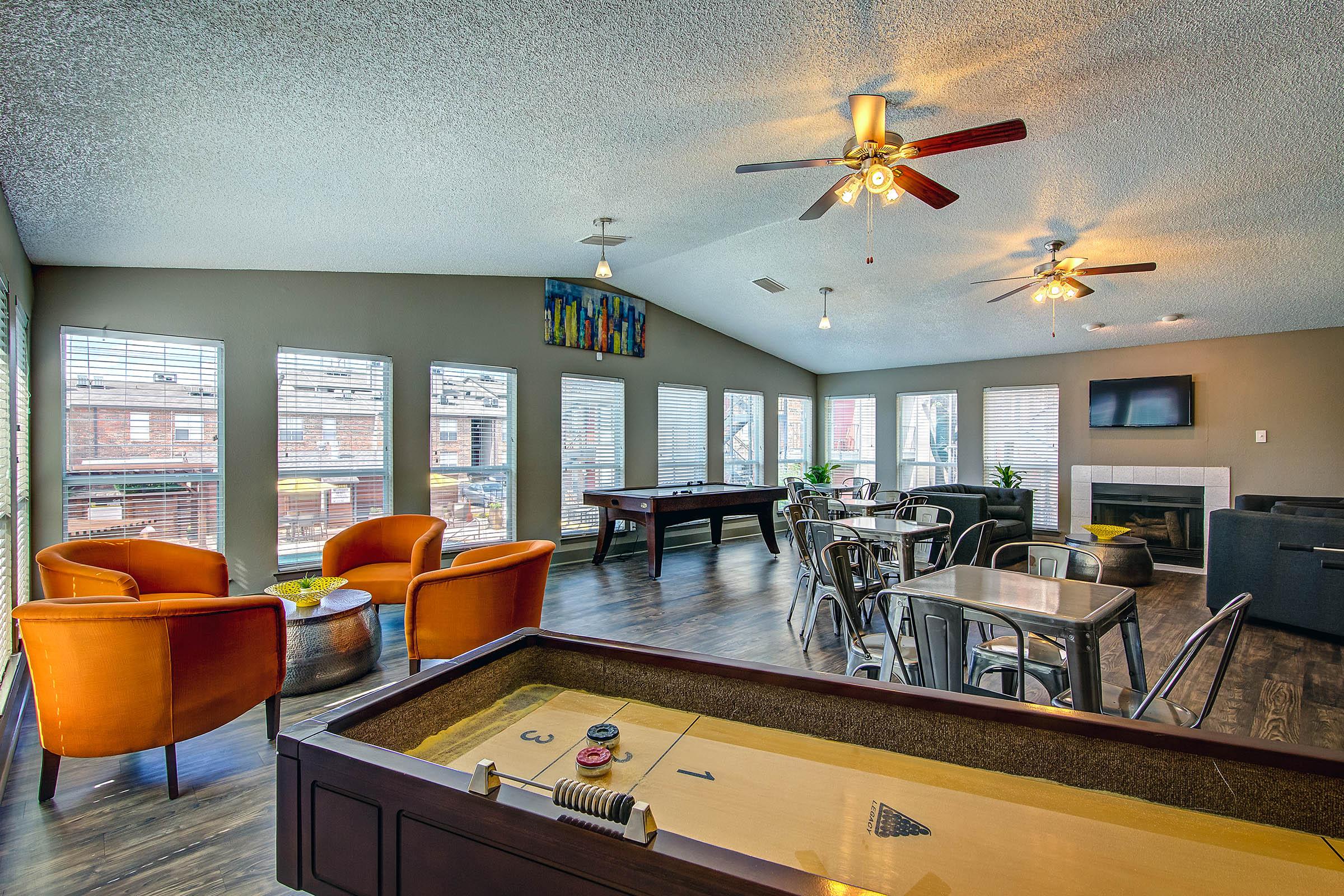 community room with a shuffle board table