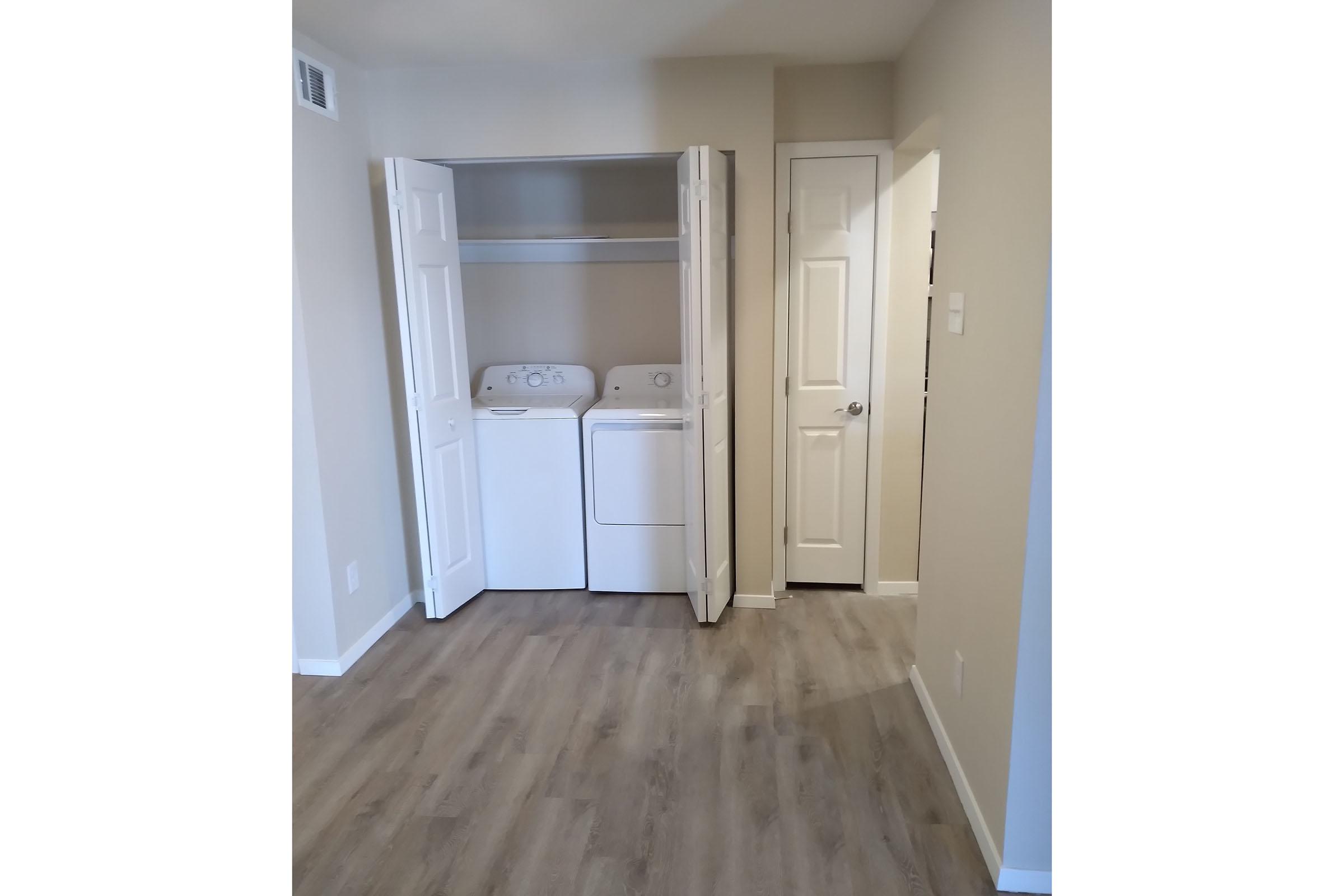 vacant washer and dryer in the laundry closet