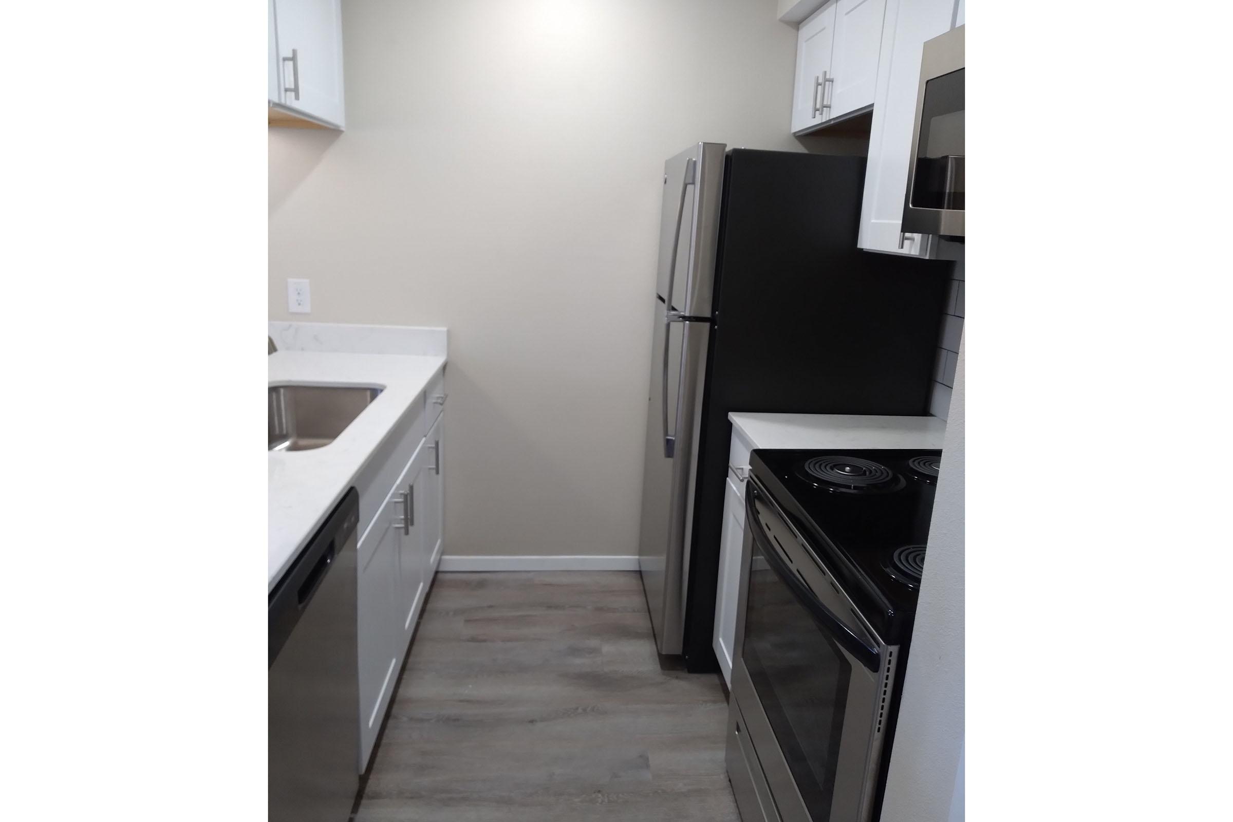 vacant kitchen with stainless steel appliances