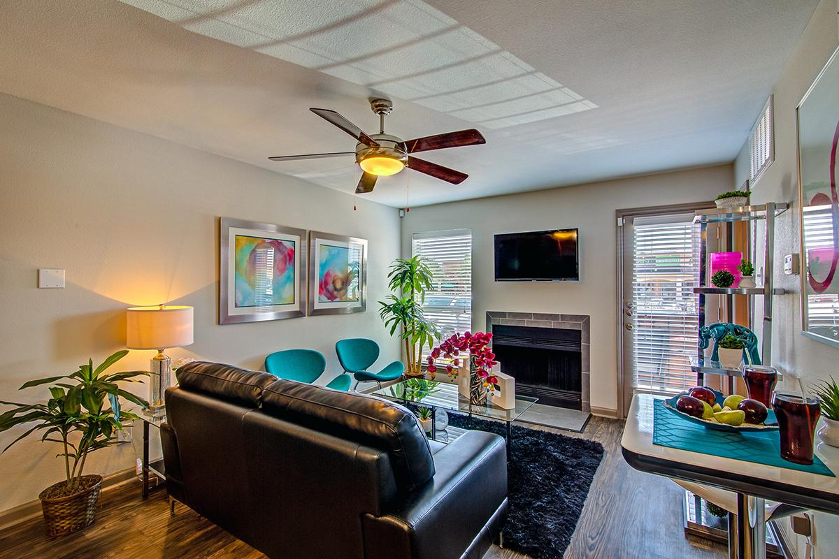 a living room filled with furniture and a flat screen tv