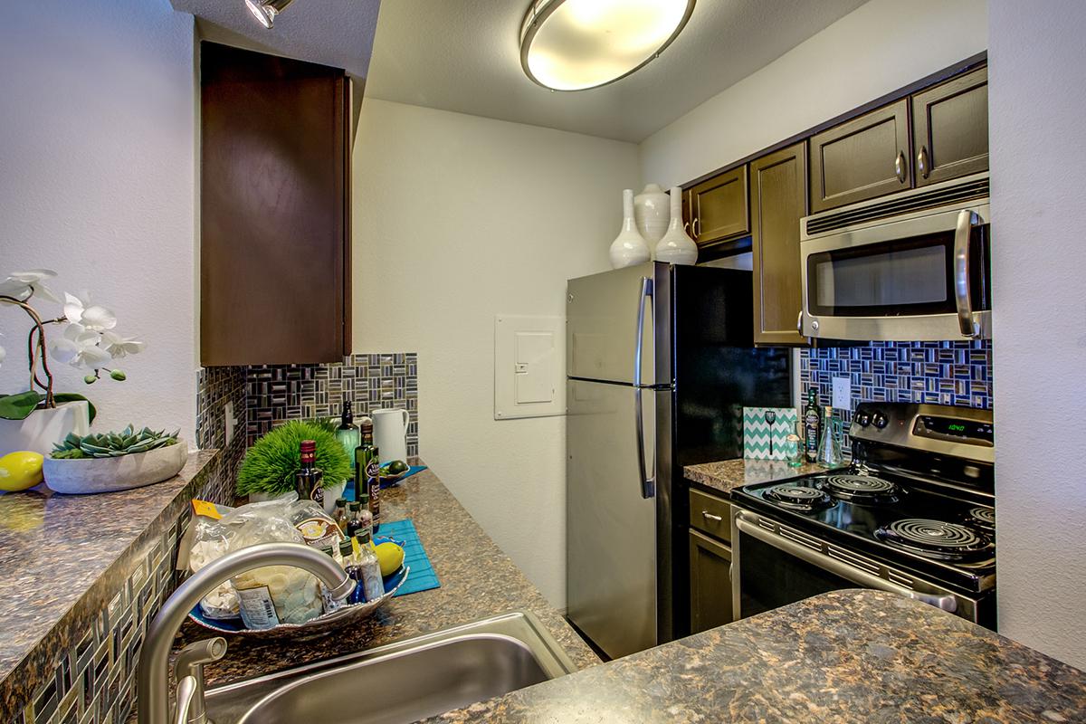 a modern kitchen with stainless steel appliances