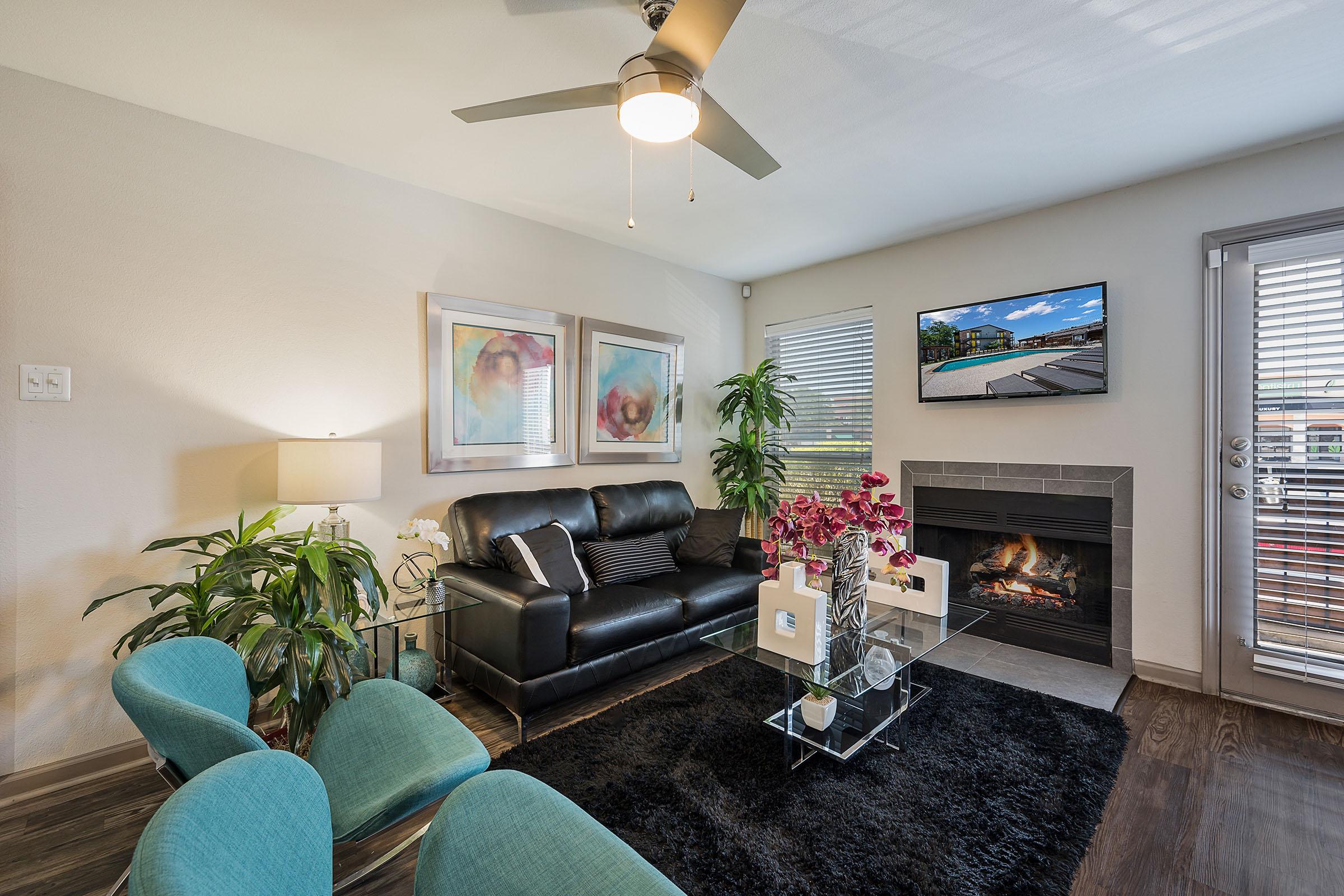 a living room filled with furniture and a fire place