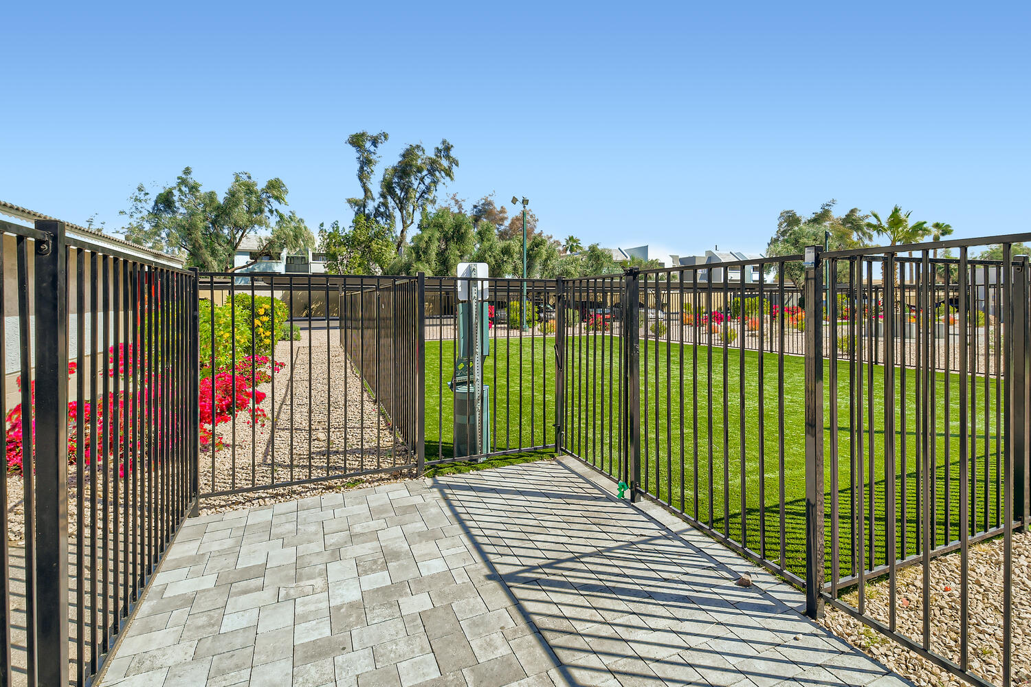 Metal fence in the middle of Rise Camelback's Glendale apartment complex