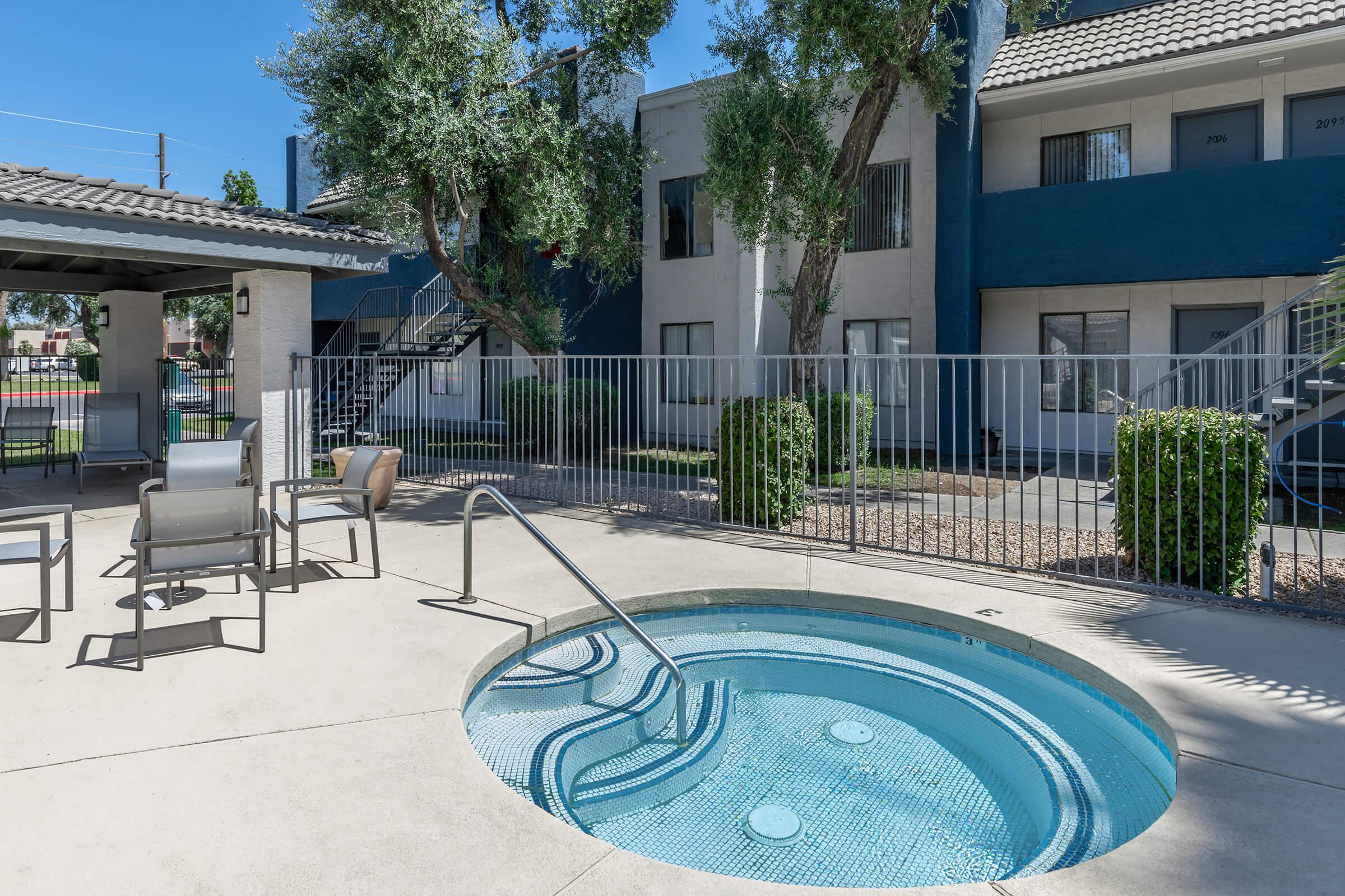 Outdoor in-ground hot tub and jacuzzi area at Rise Camelback