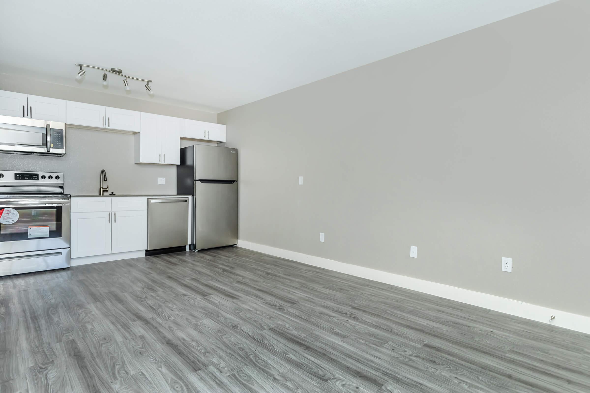 Modern spacious dining room area next to renovated kitchen