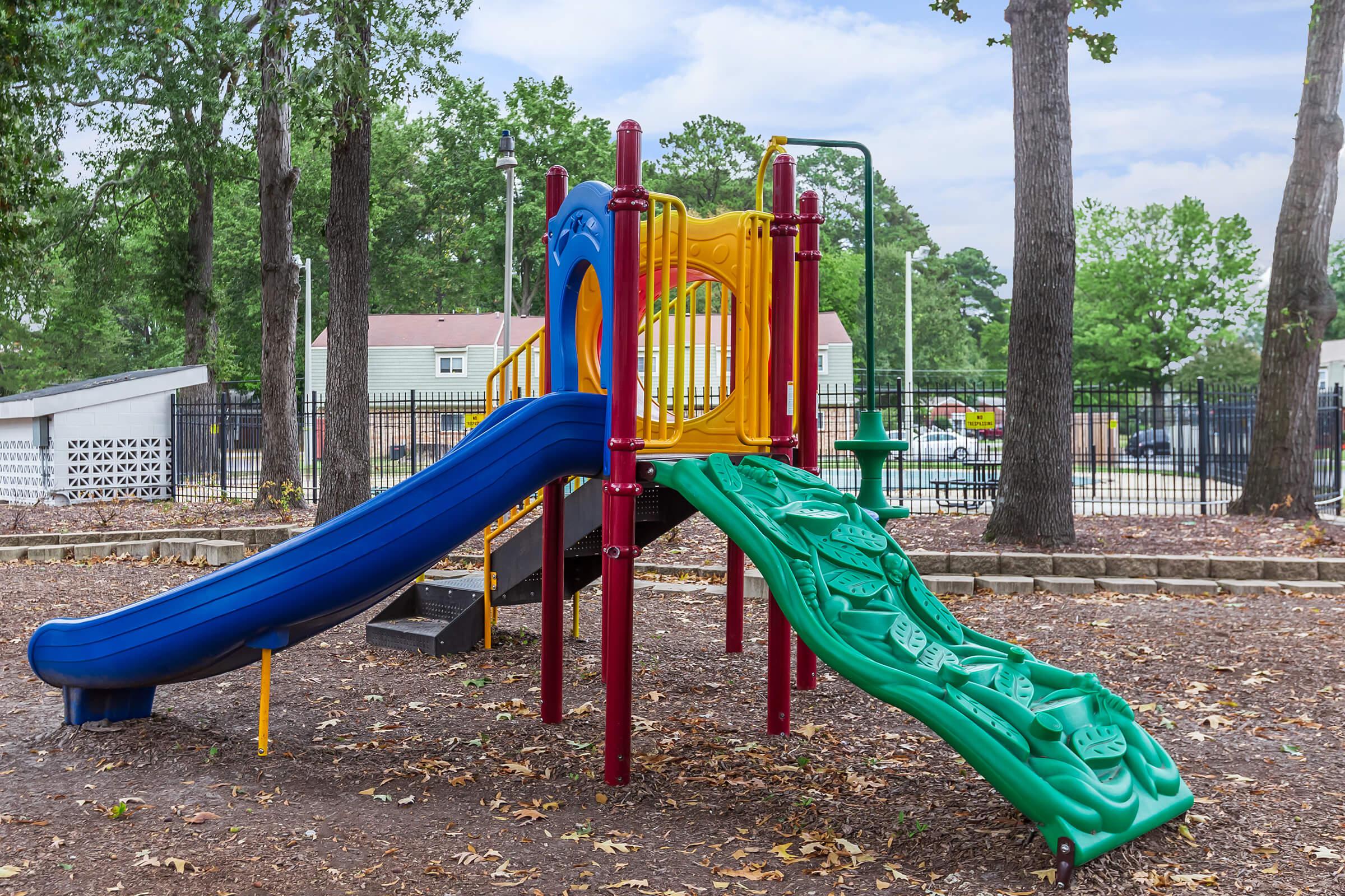 a chair sitting in front of a playground