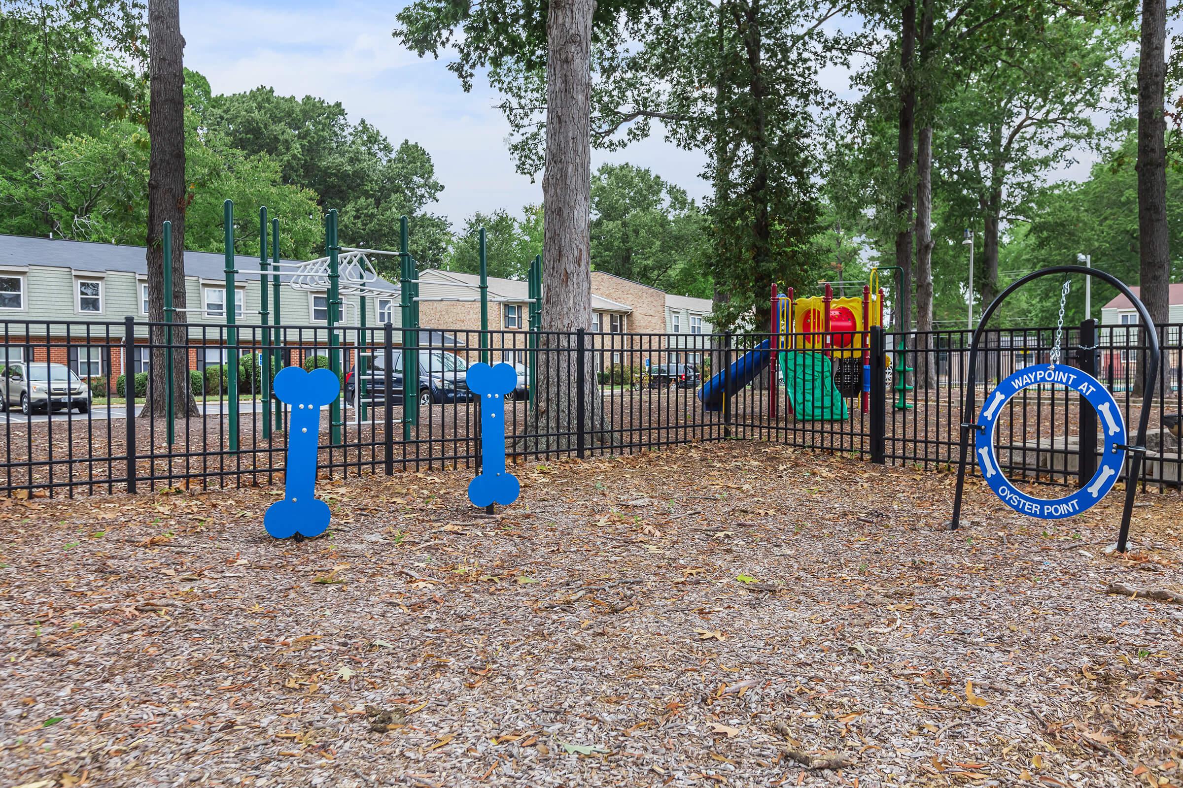 a playground in front of a fence