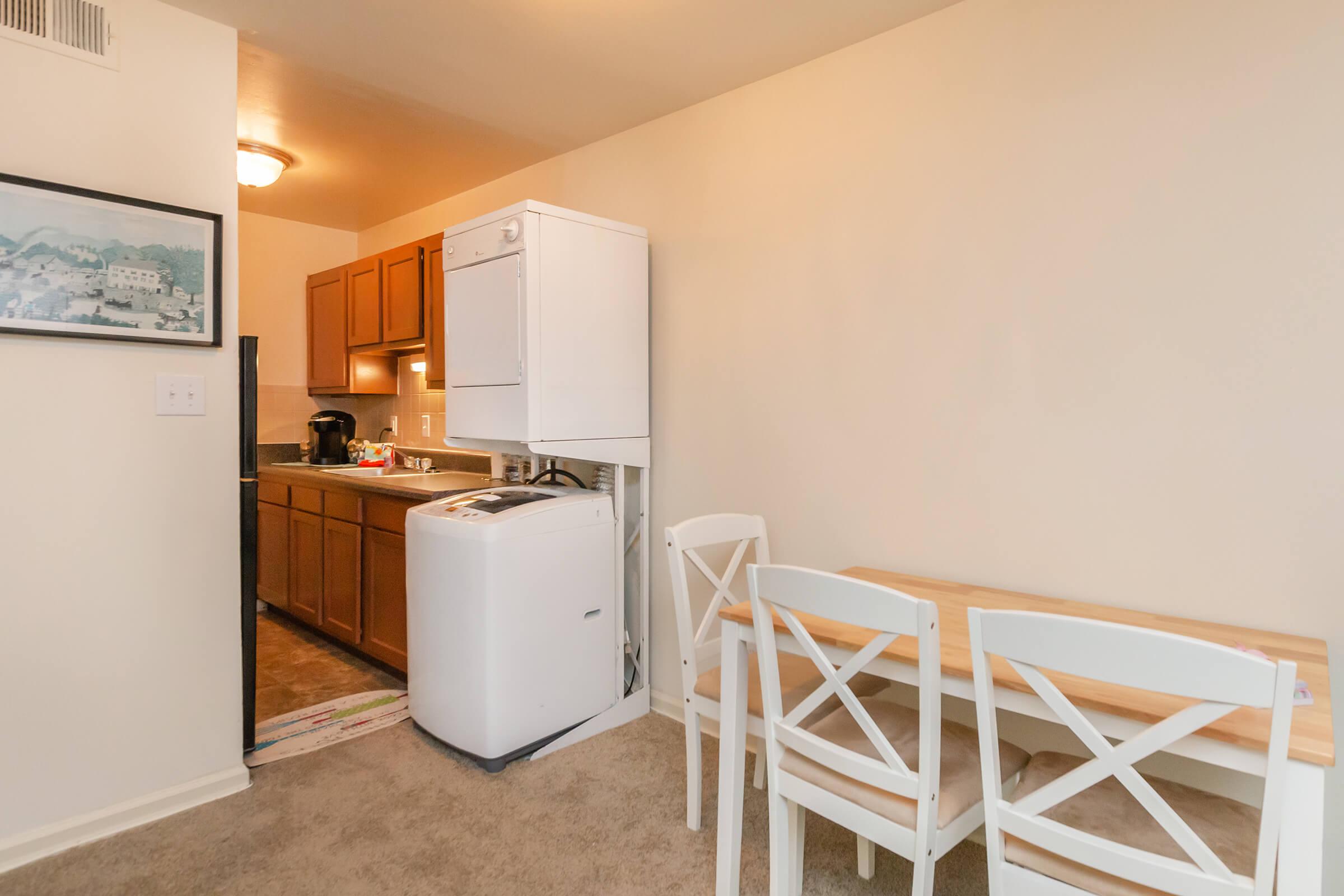 a white refrigerator freezer sitting in a room