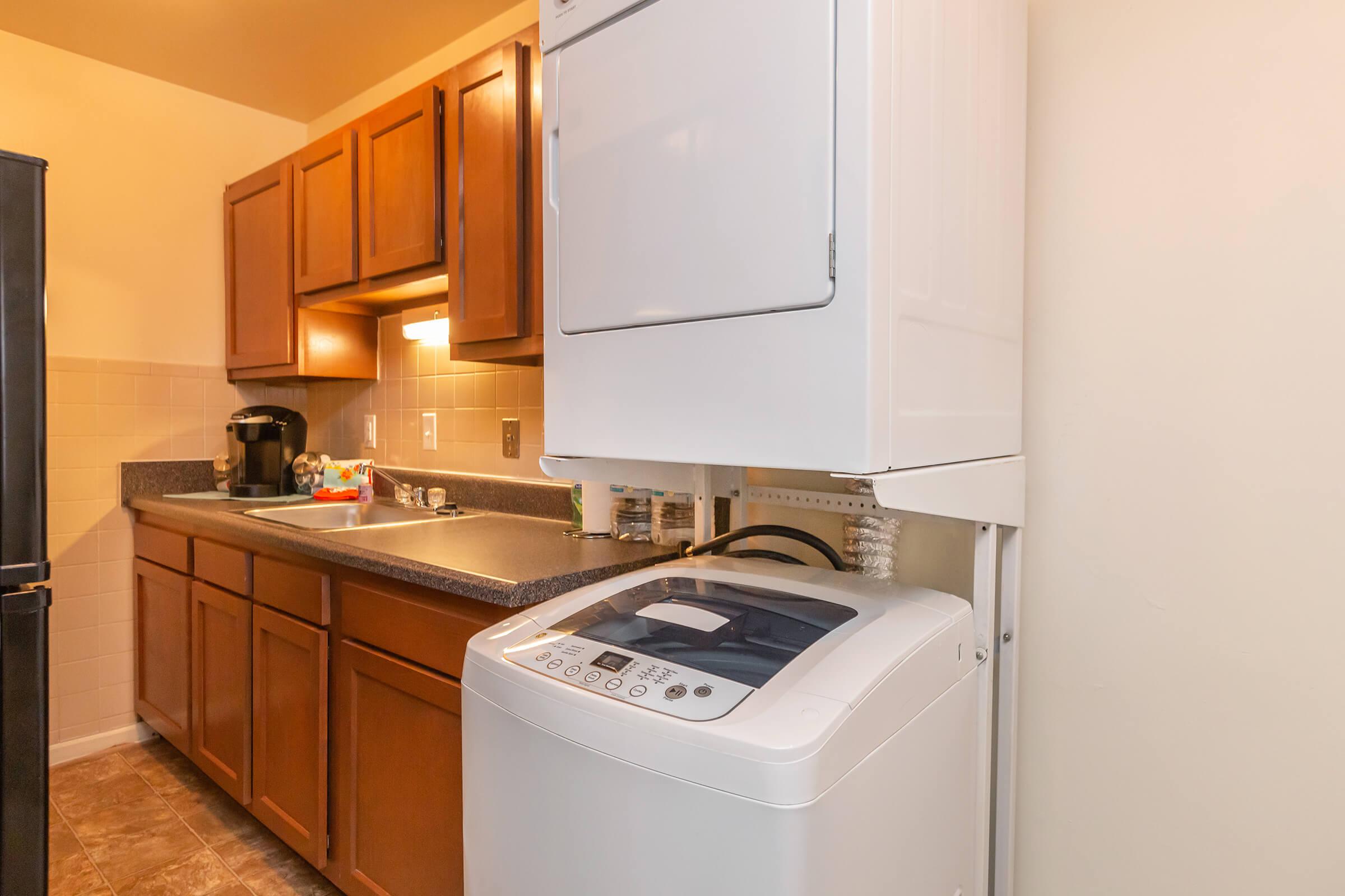 a white refrigerator freezer sitting inside of a kitchen