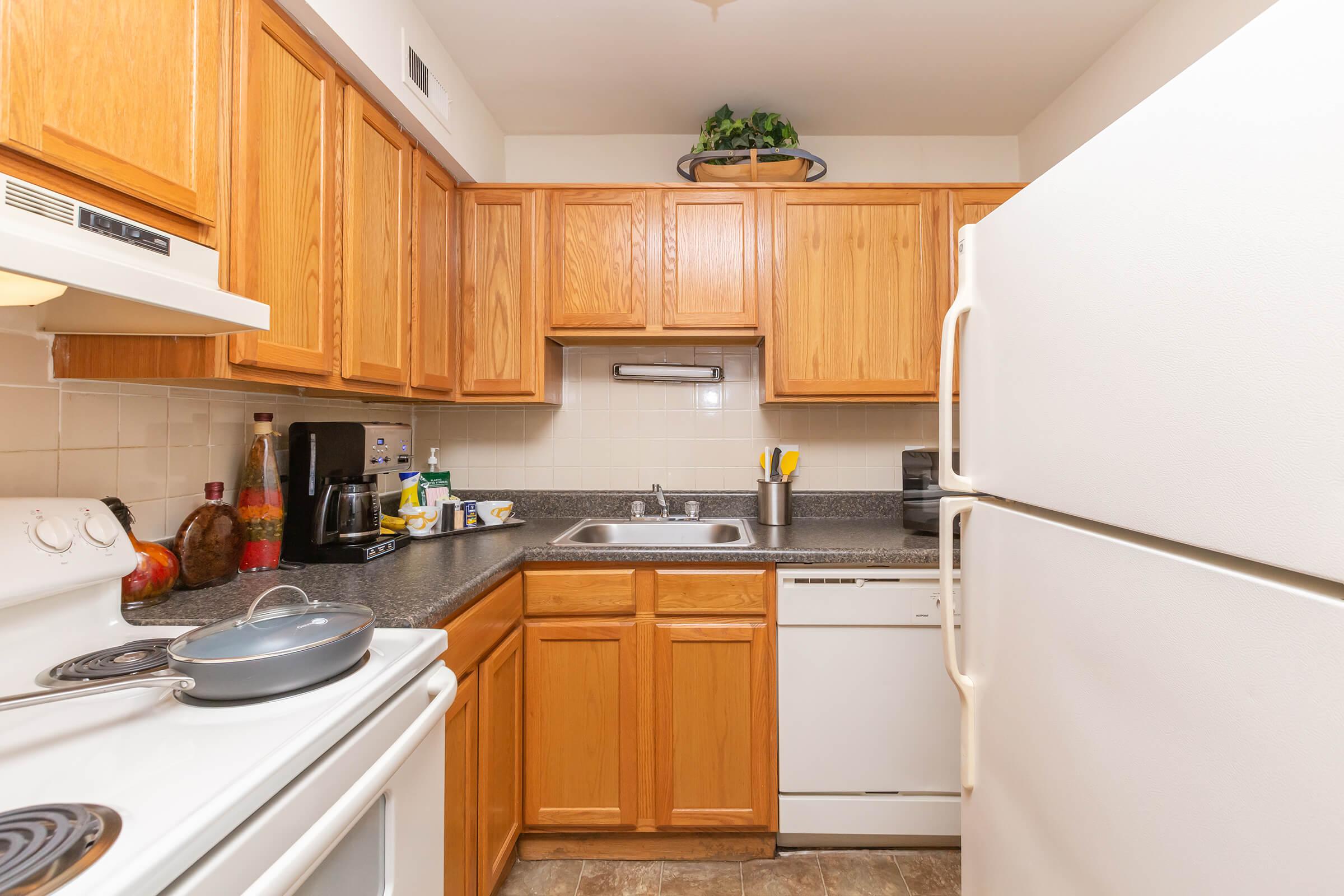 a kitchen with a stove and a refrigerator