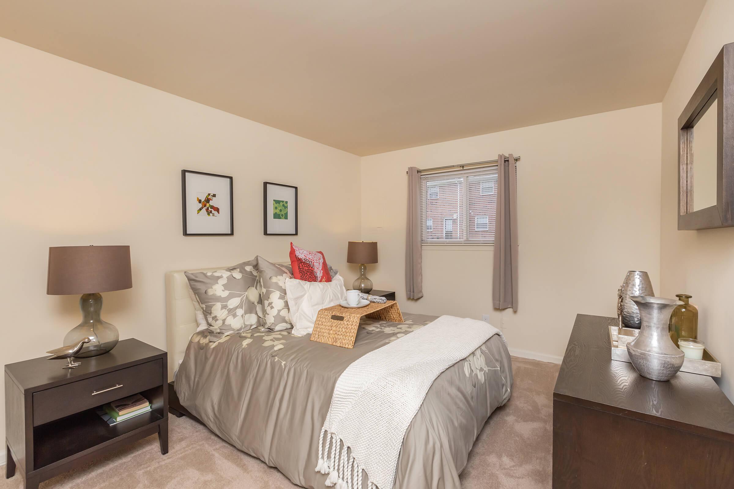 a bedroom with a bed in a hotel room