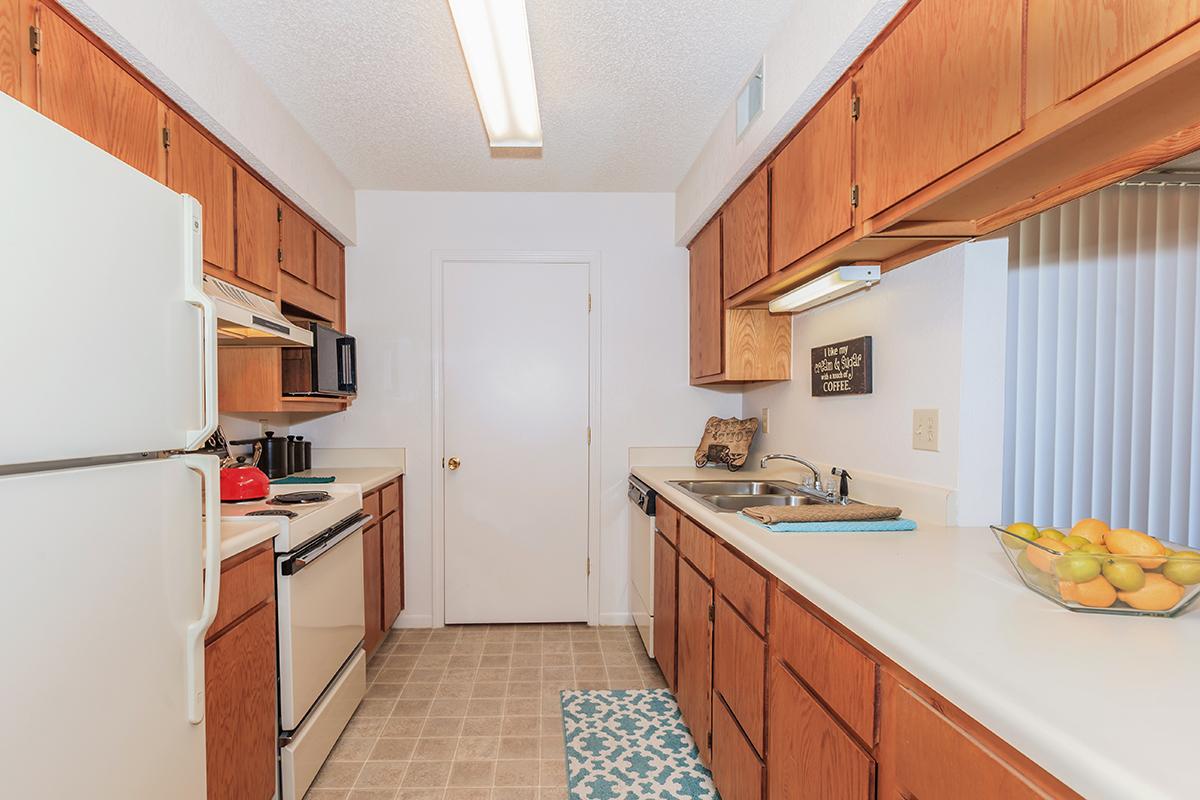 a kitchen with a stove and a refrigerator
