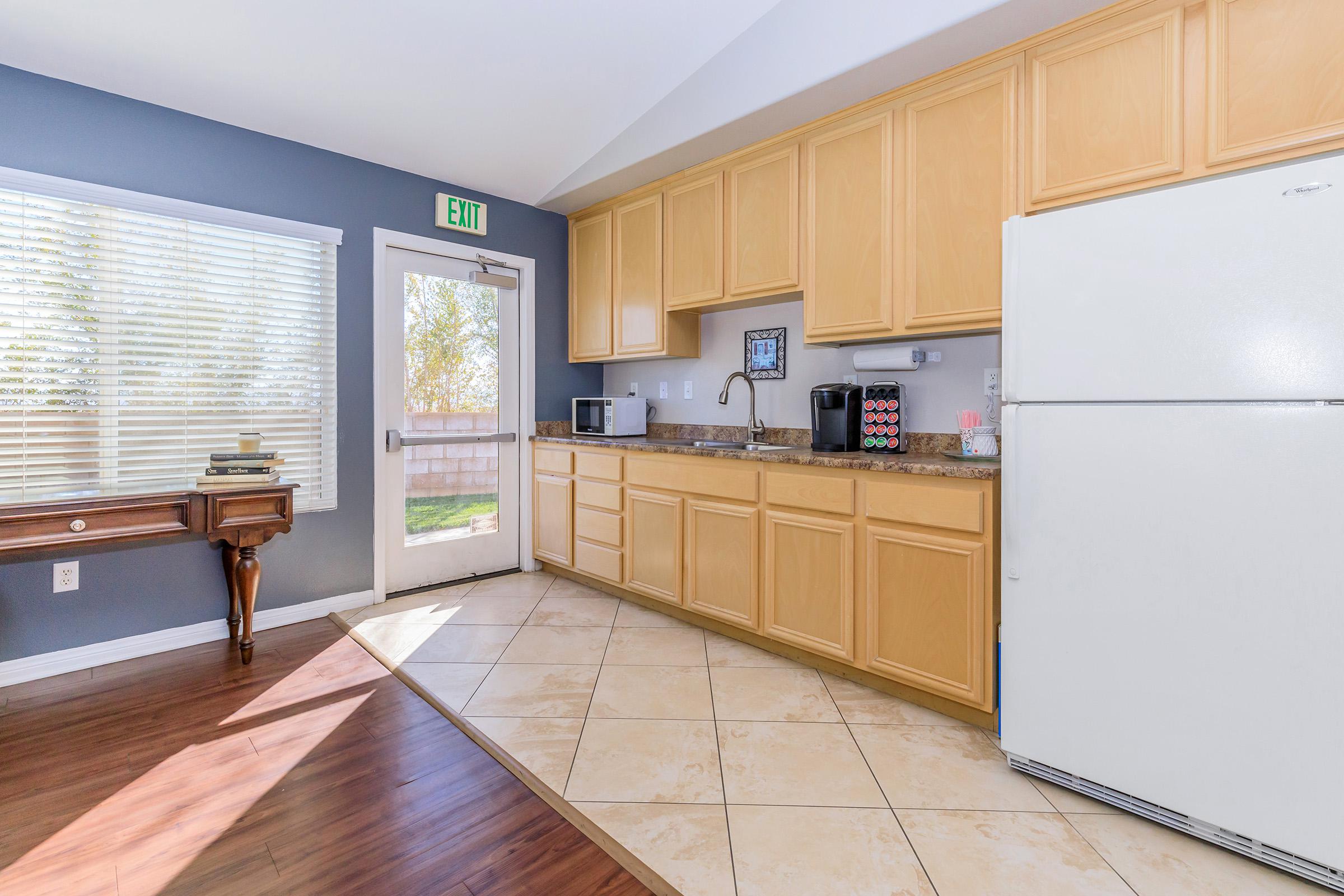 a kitchen with a wooden floor