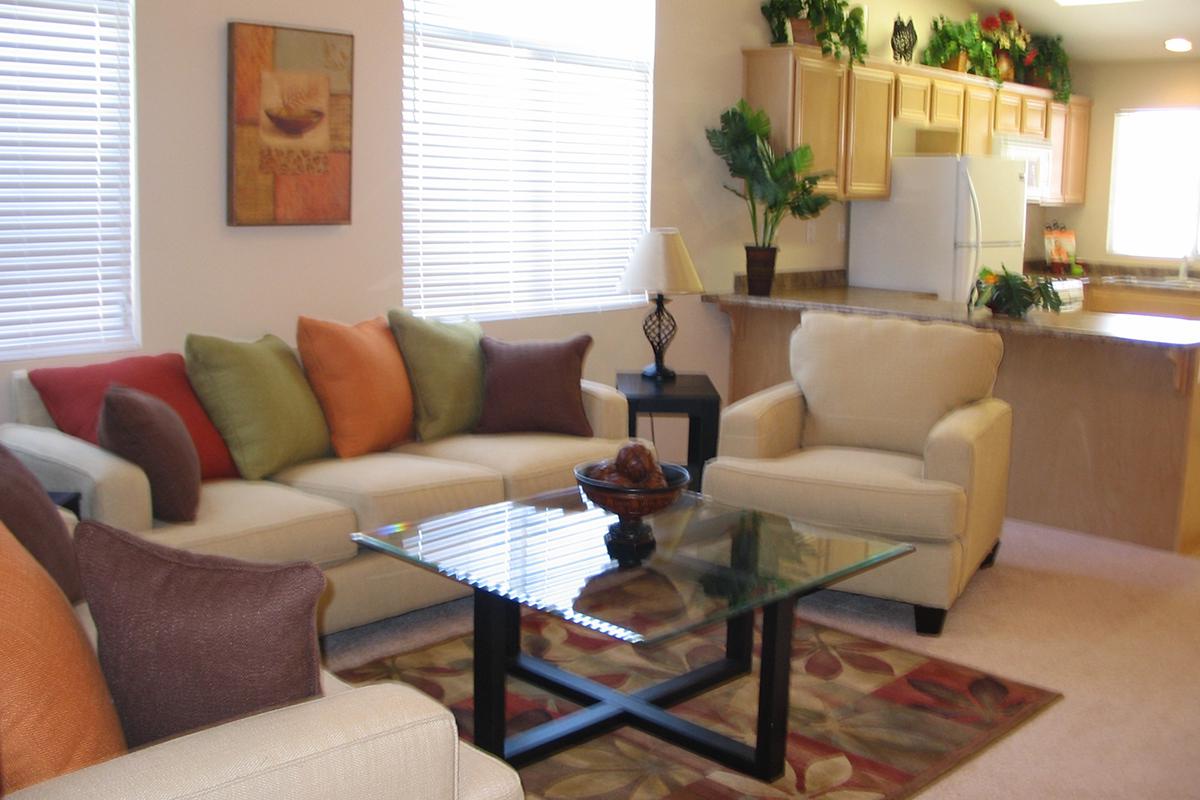 a living room filled with furniture and a fire place