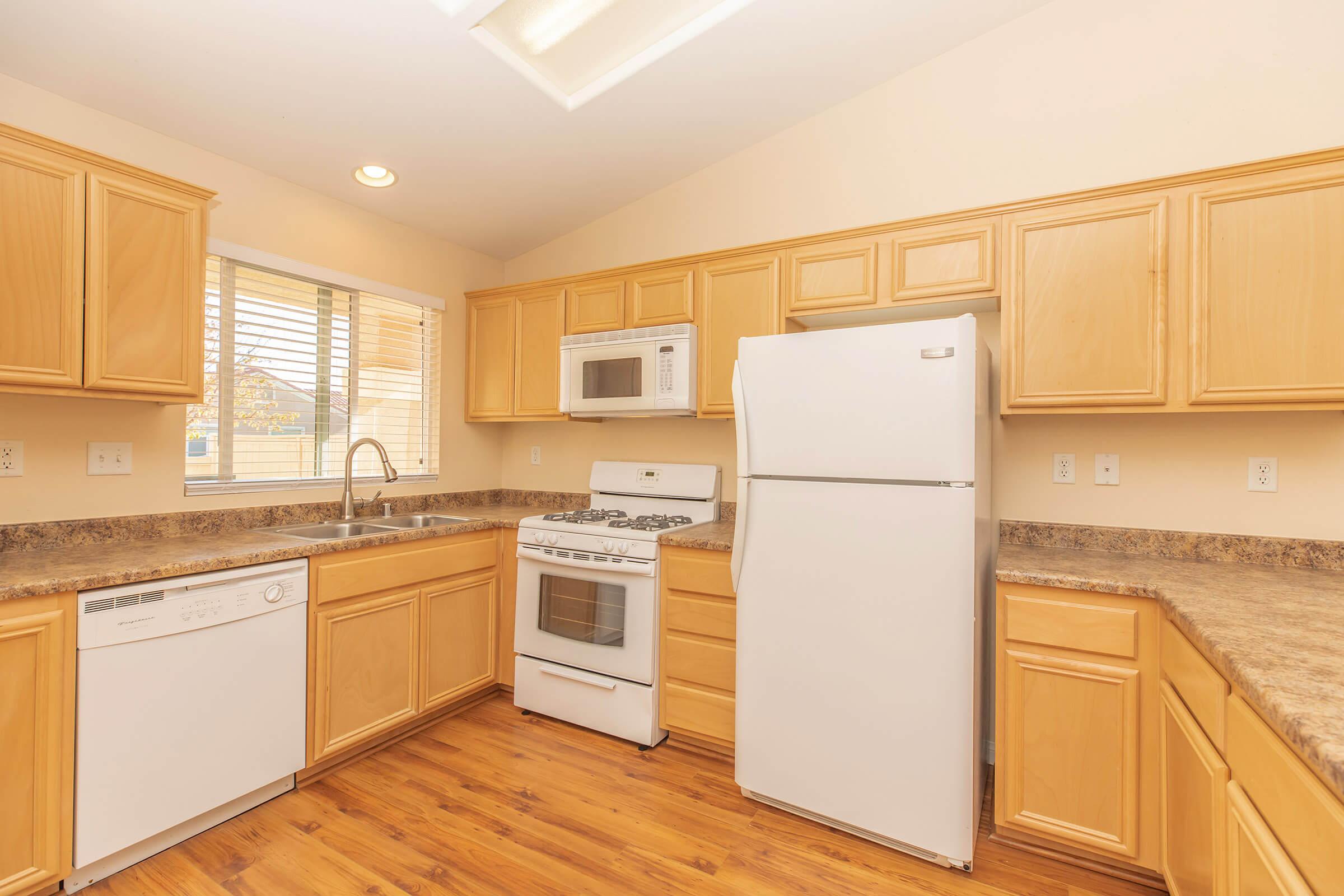 a kitchen with a refrigerator stove and microwave