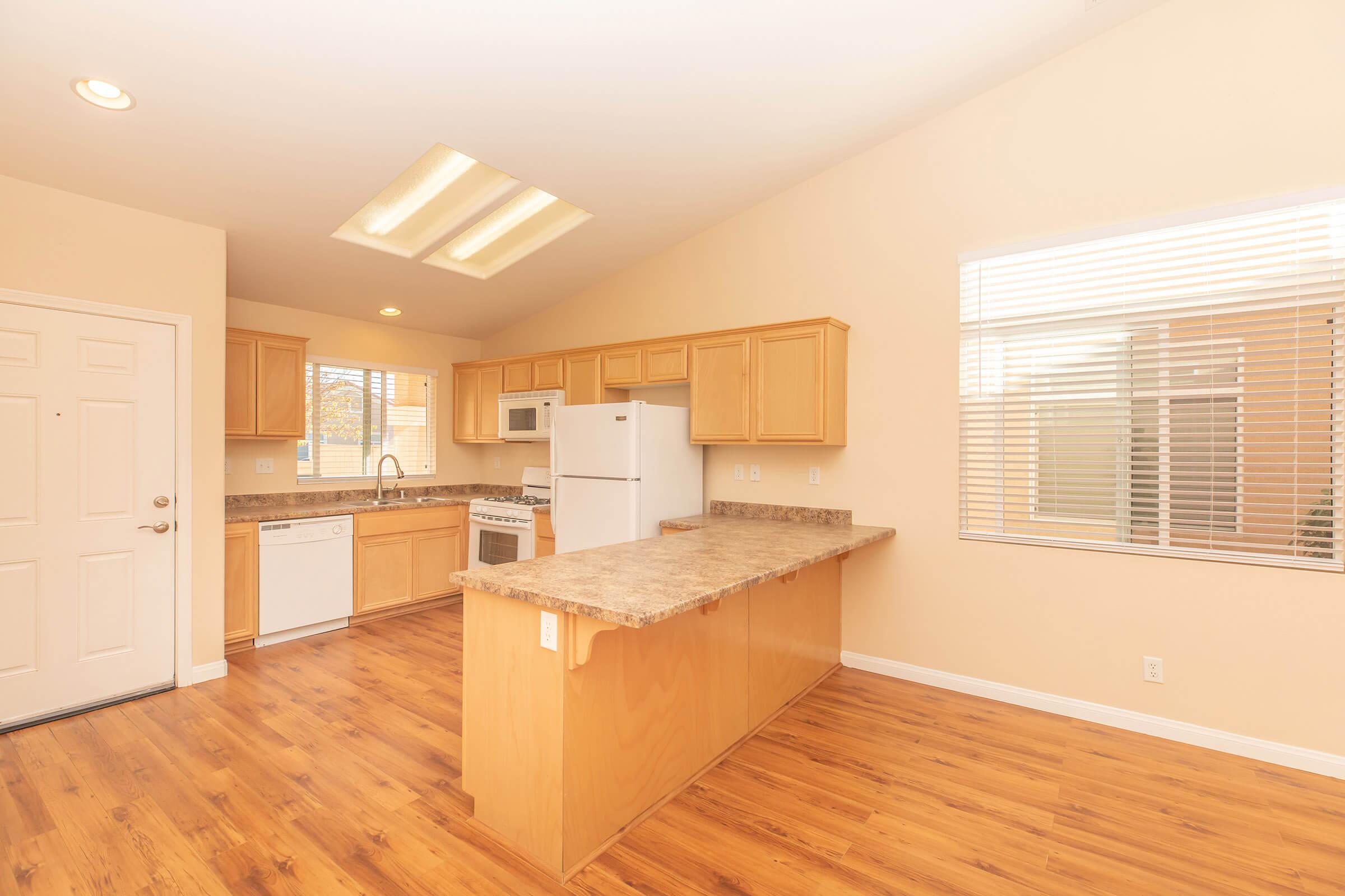 a kitchen with a wood floor