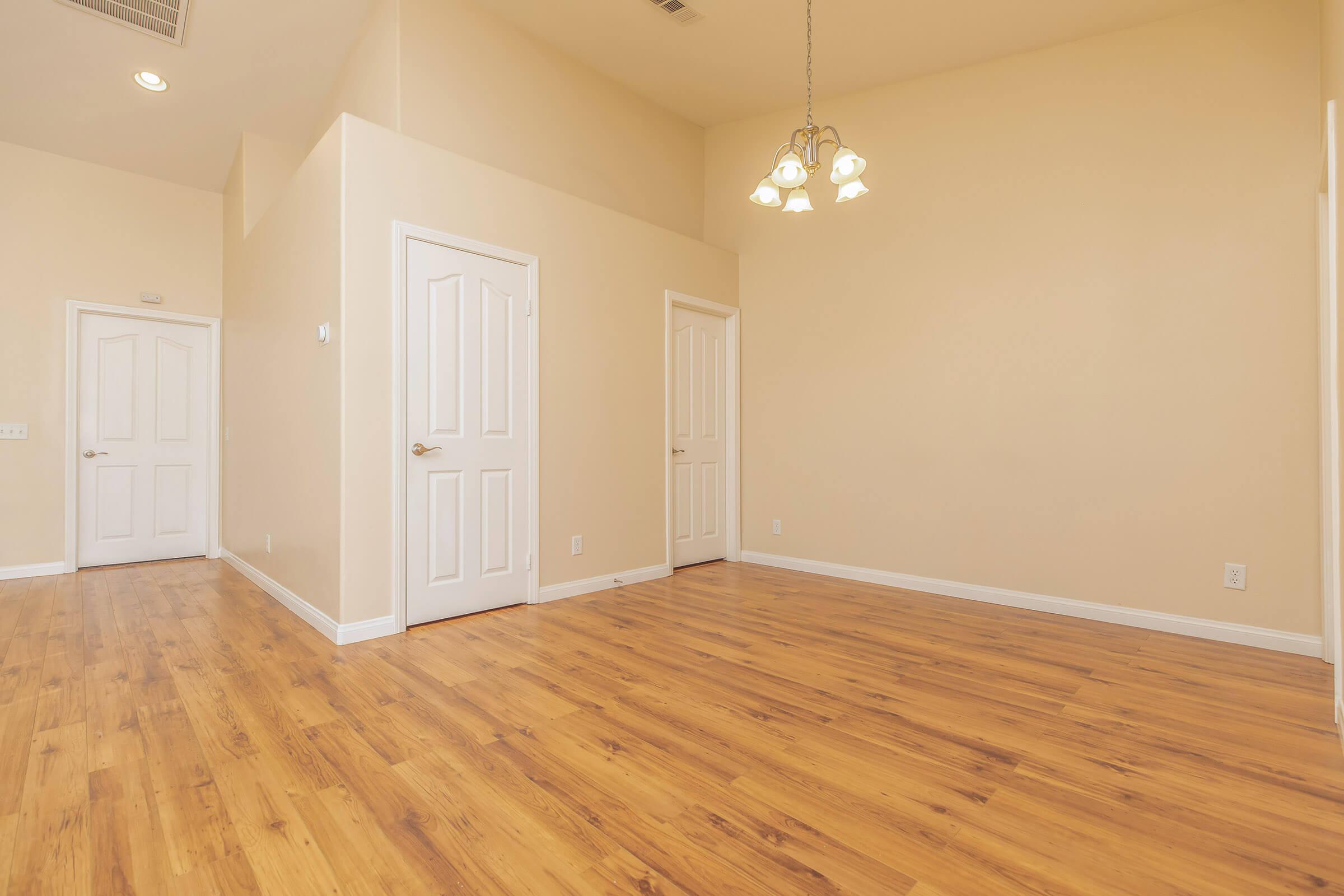 a large empty room with a wooden floor