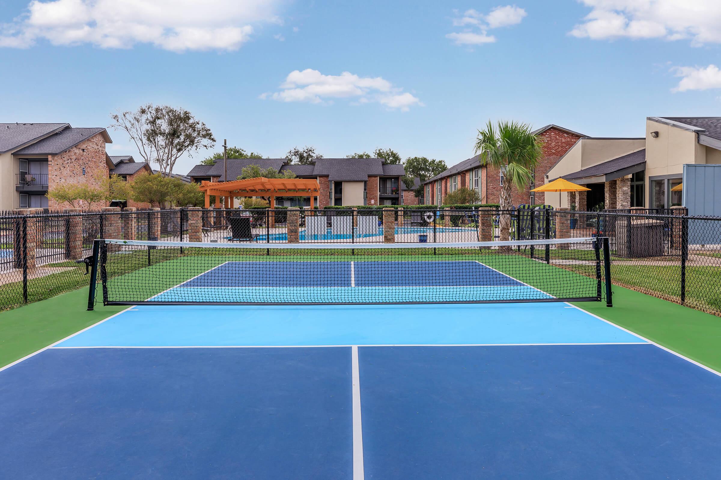 a building with a racket on a court