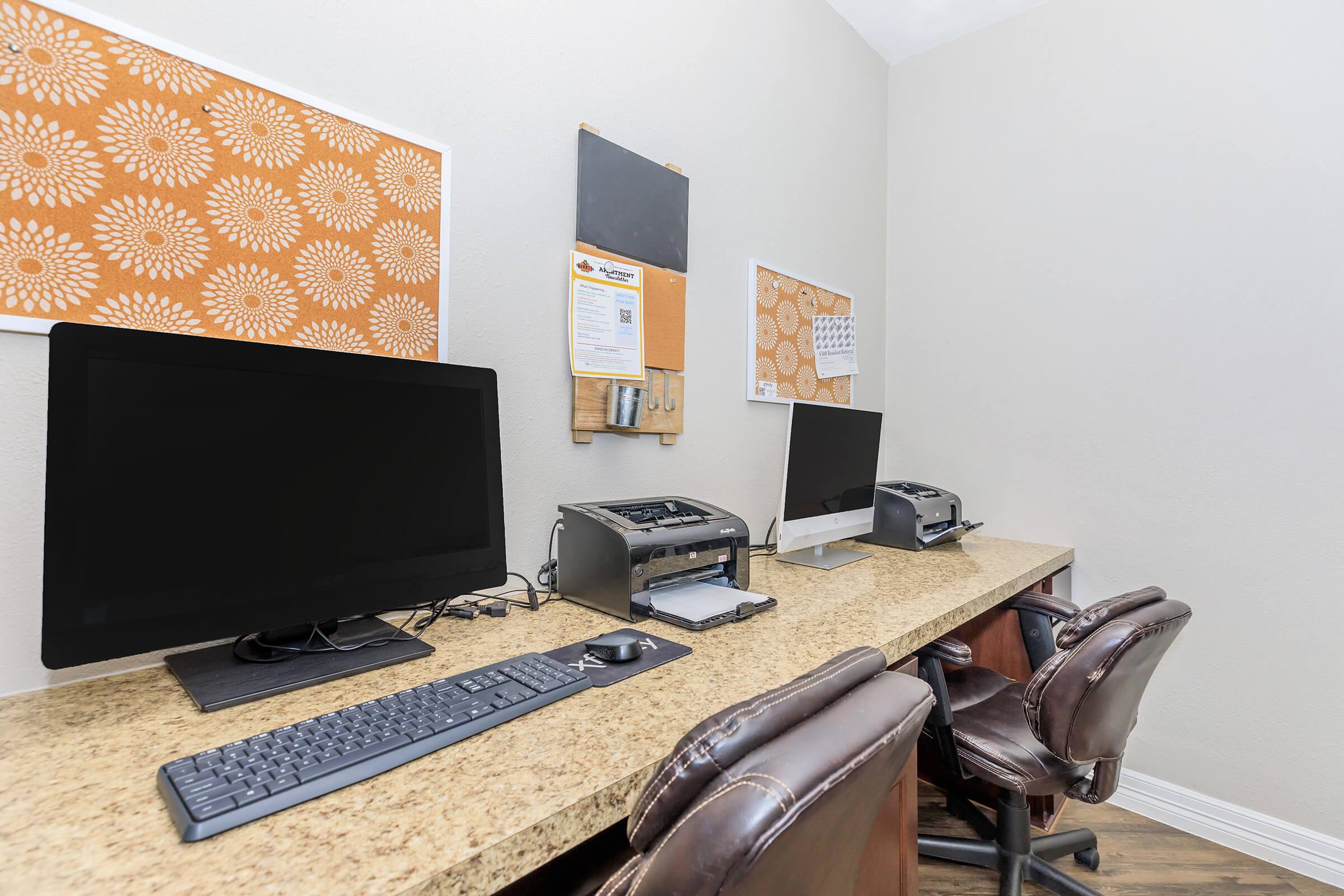 a flat screen tv sitting on top of a desk