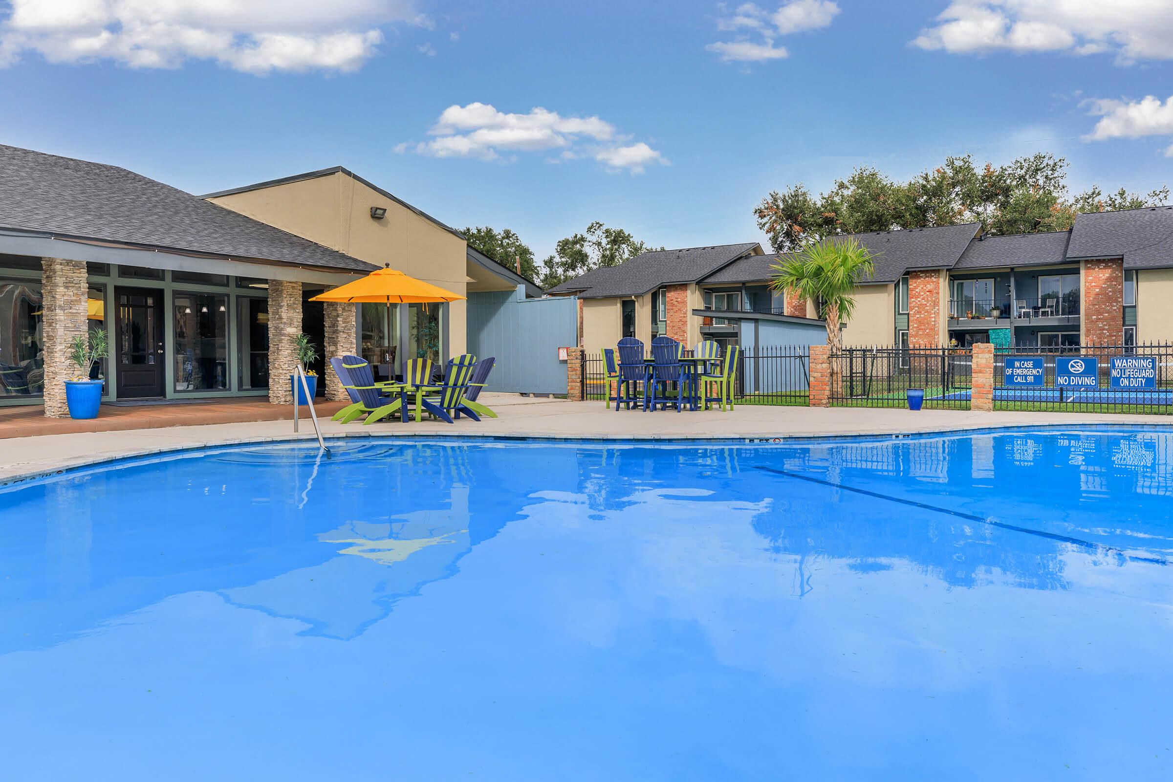 a large pool of water in front of a house