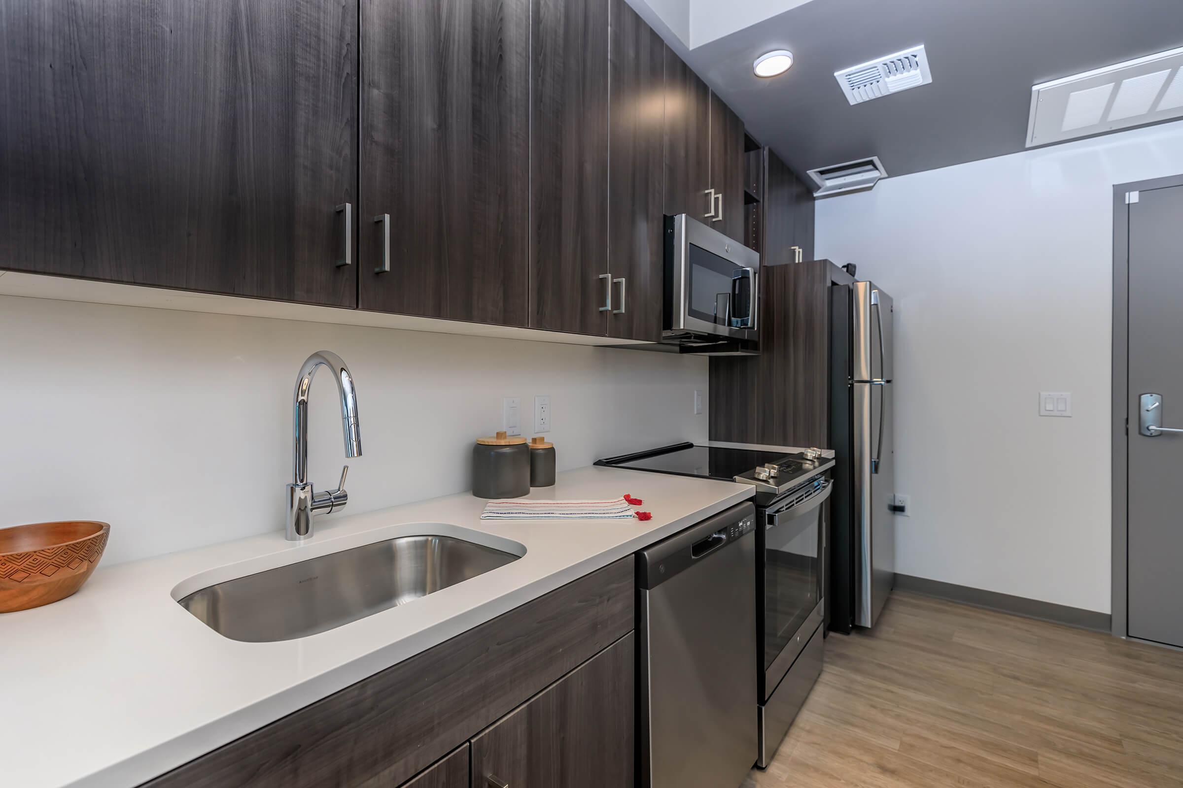 a modern kitchen with stainless steel appliances