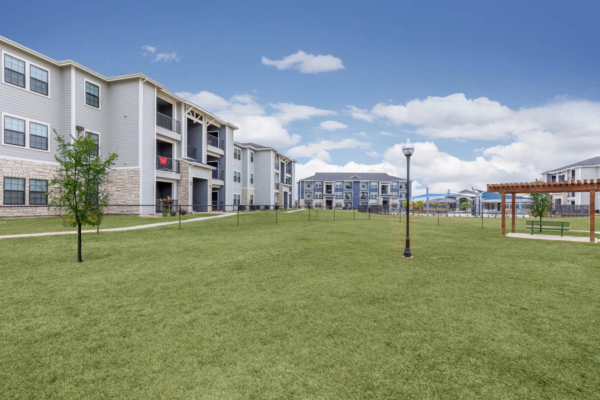 a building with a grassy field