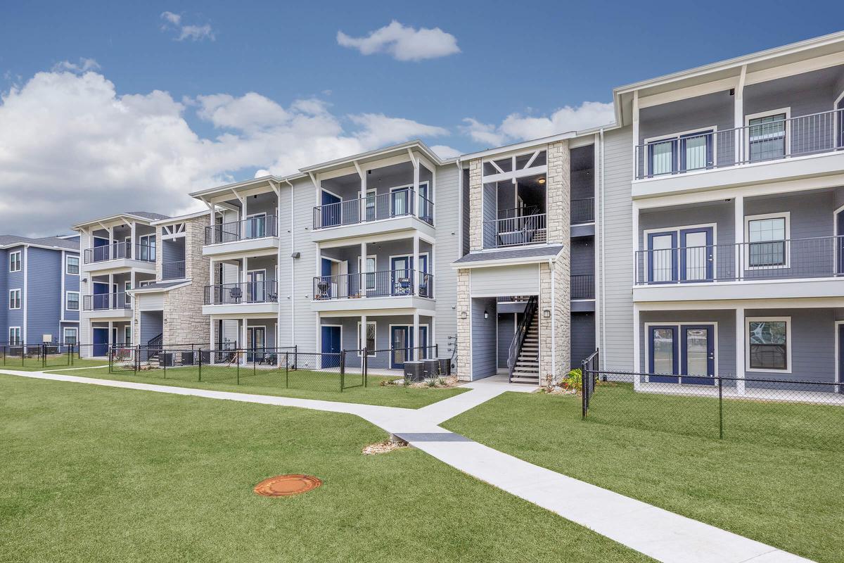 a large lawn in front of a building