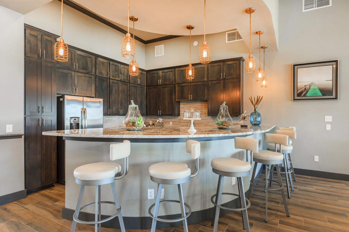 a kitchen with an island in the middle of a room